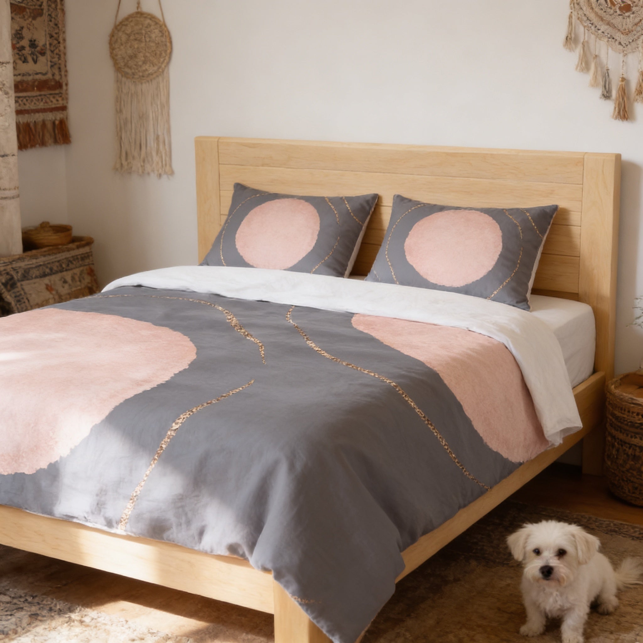 a cozy bedroom with a wooden bed frame, a gray and pink patterned comforter, and a small white dog sitting on the floor next to the bed.