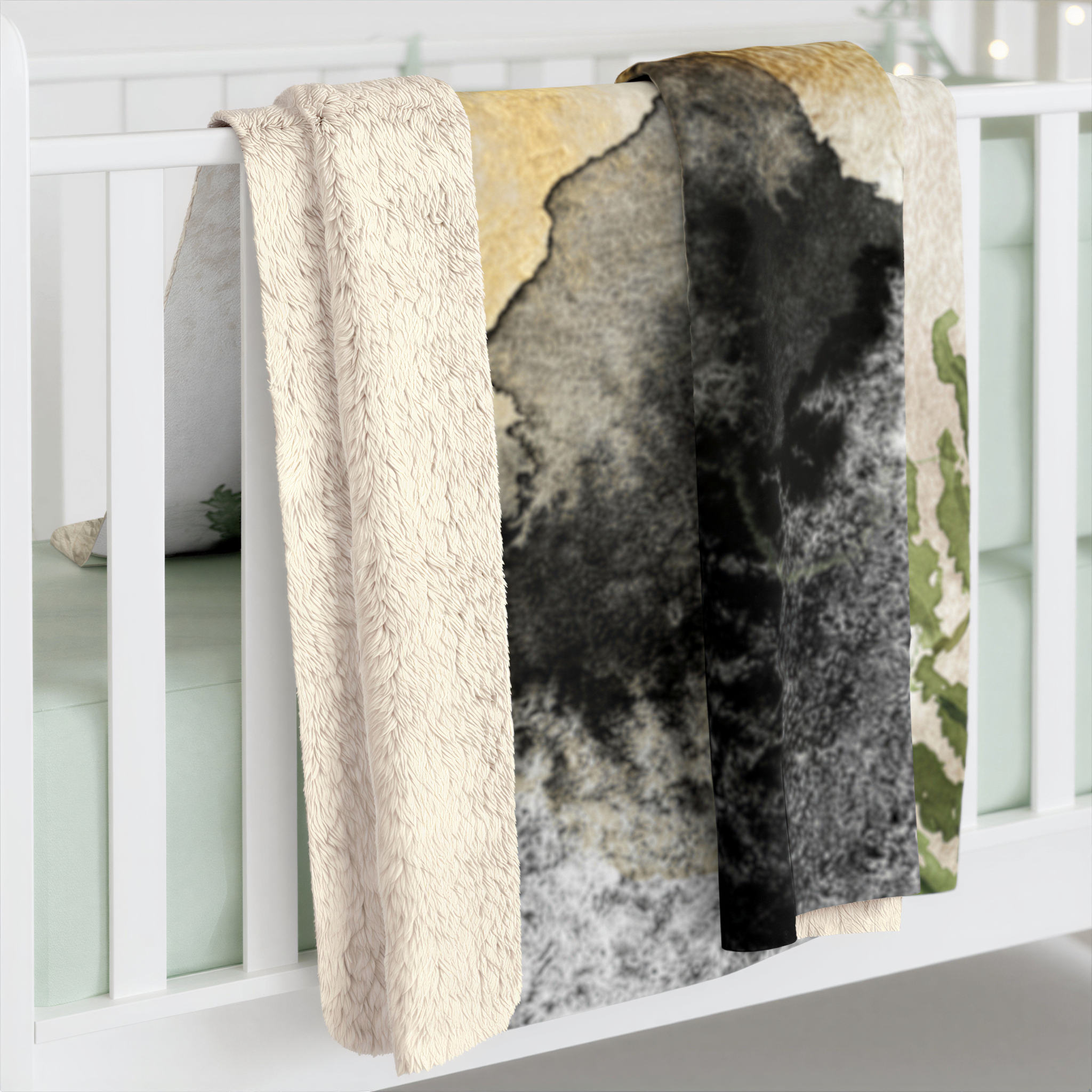 Black, ivory and forest green boho floral throw blanket styled in a cozy living room