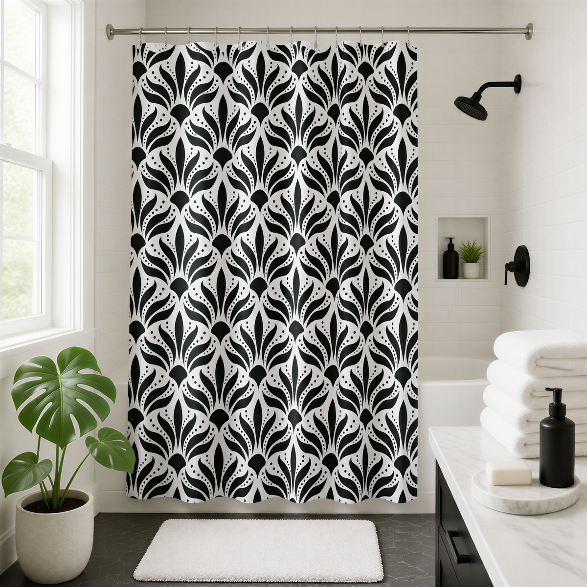 a bathroom with a black and white patterned shower curtain, a potted plant, and a stack of white towels.