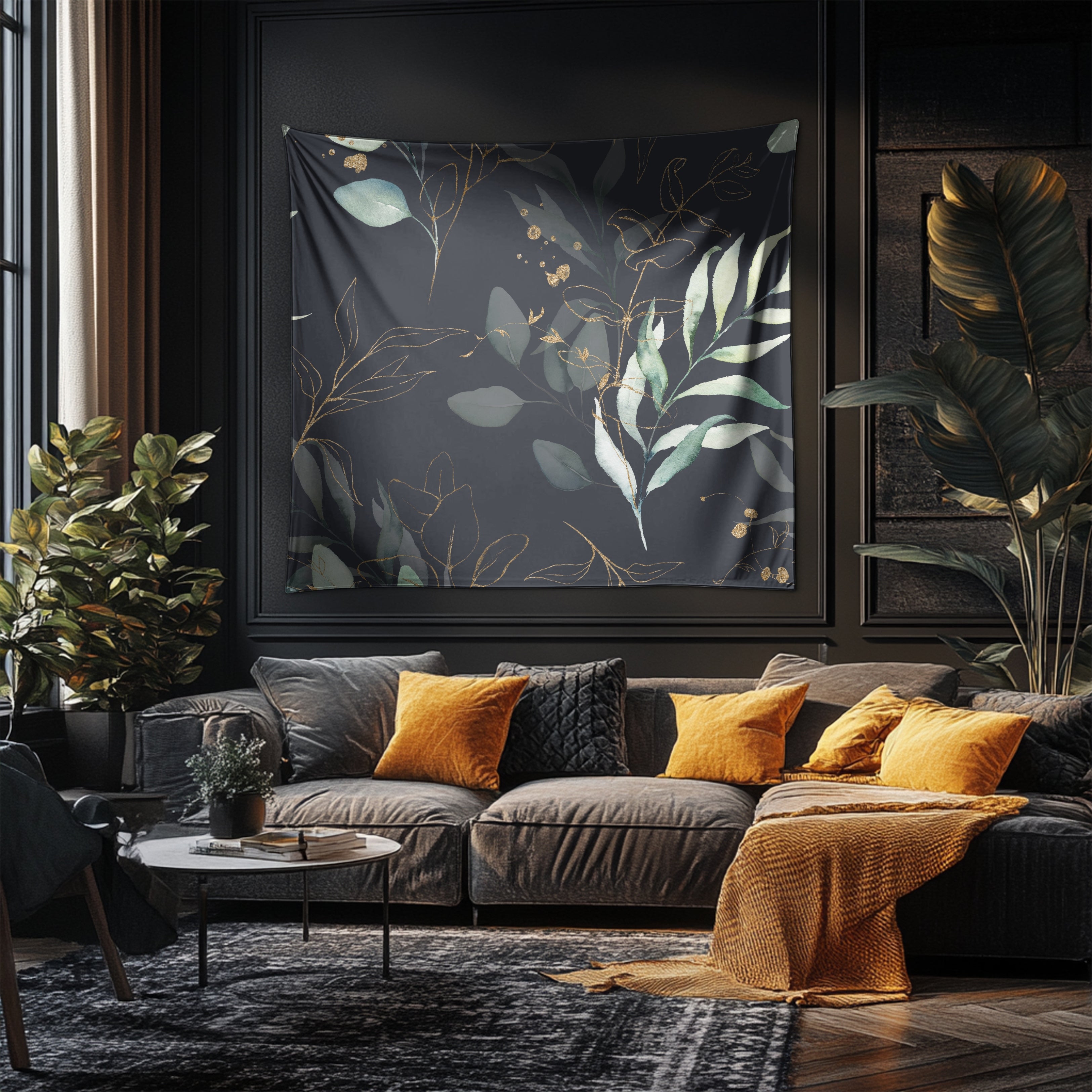 a modern living room with a large black and gold tapestry hanging on the wall behind a gray sectional sofa adorned with orange throw pillows. The room is decorated with various plants and a coffee table, creating a cozy and stylish atmosphere.