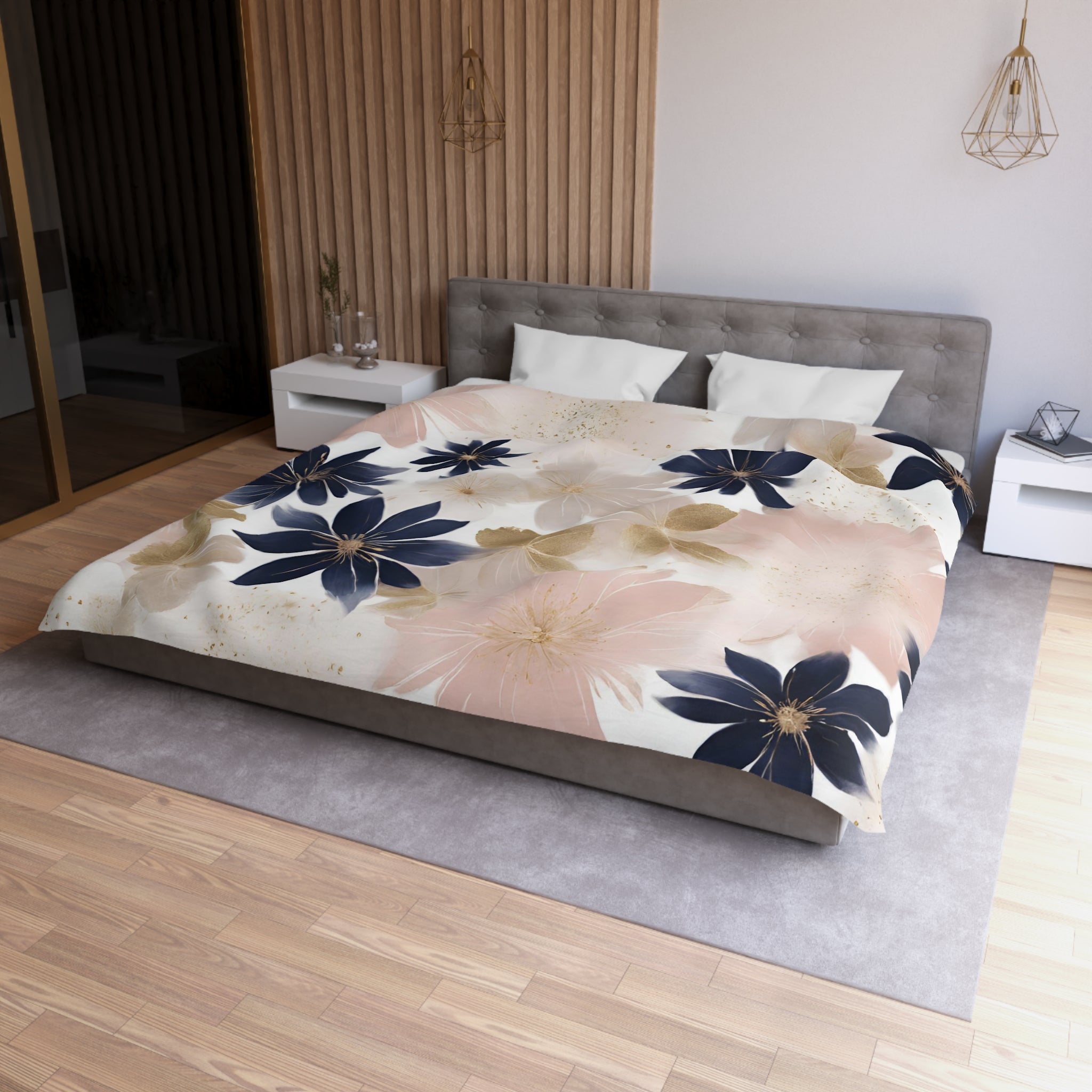 a modern bedroom with a large bed, a gray headboard, and a floral print bedspread. The room has a wooden floor and white walls, creating a serene and elegant atmosphere.