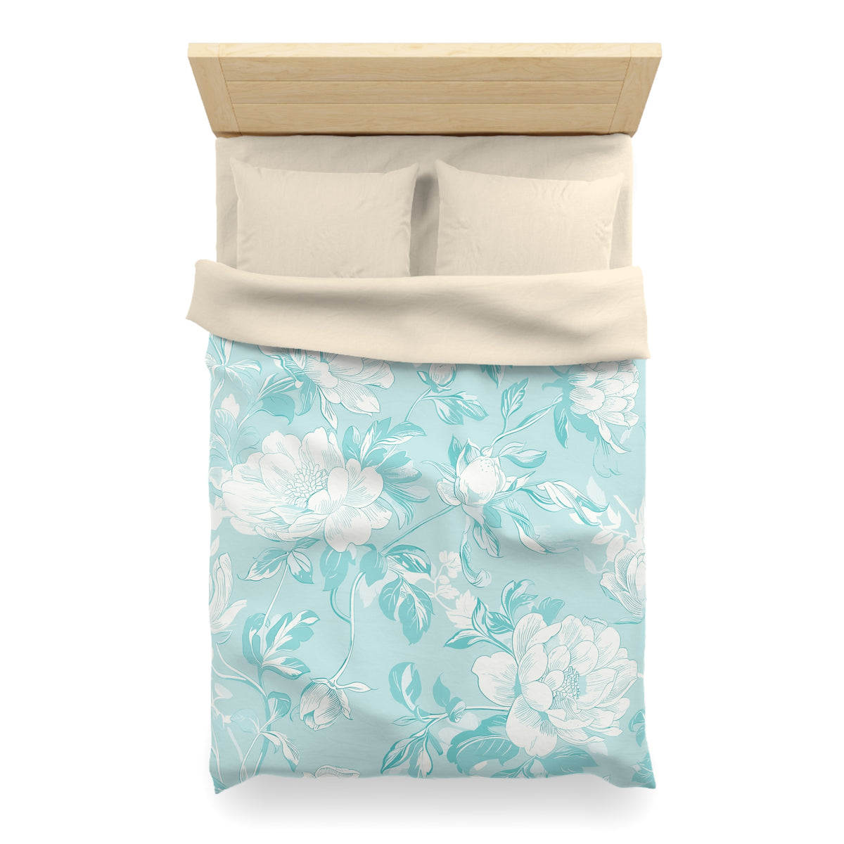 A neatly made bed with a floral patterned comforter and pillows.