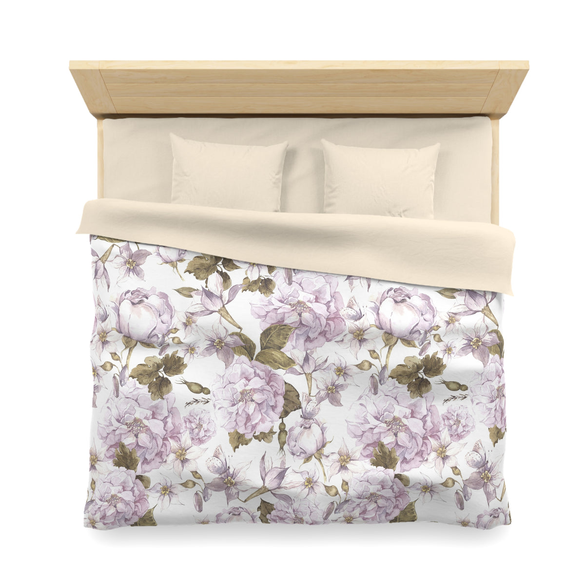 a neatly made bed with a floral print comforter and pillows.