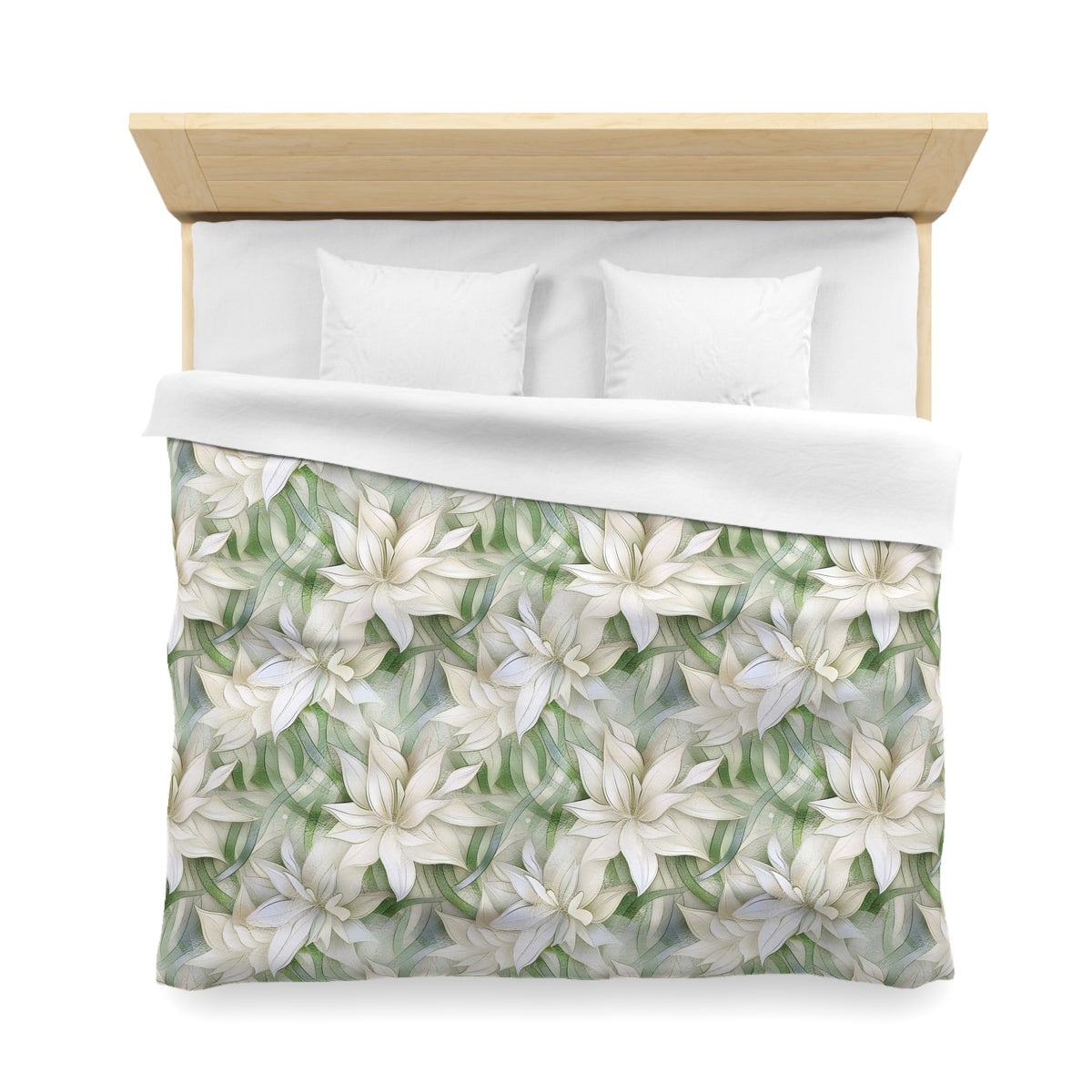 a neatly made bed with a floral patterned comforter and two white pillows.