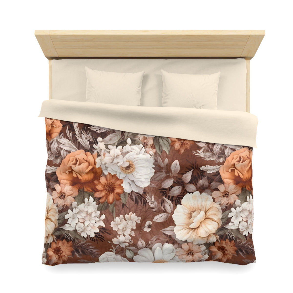 a bed with a floral print comforter and pillows.