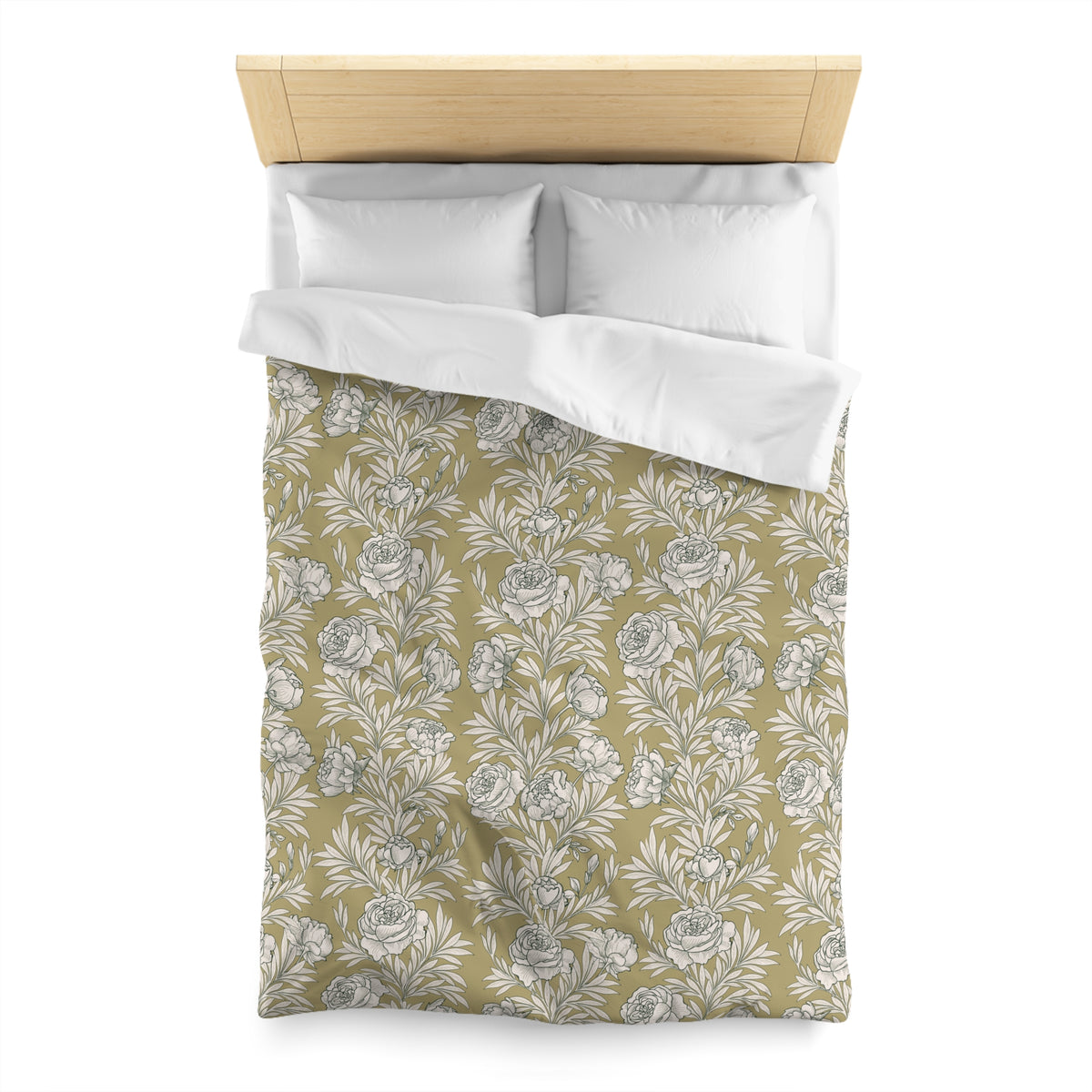 a neatly made bed with a floral patterned comforter and pillows.