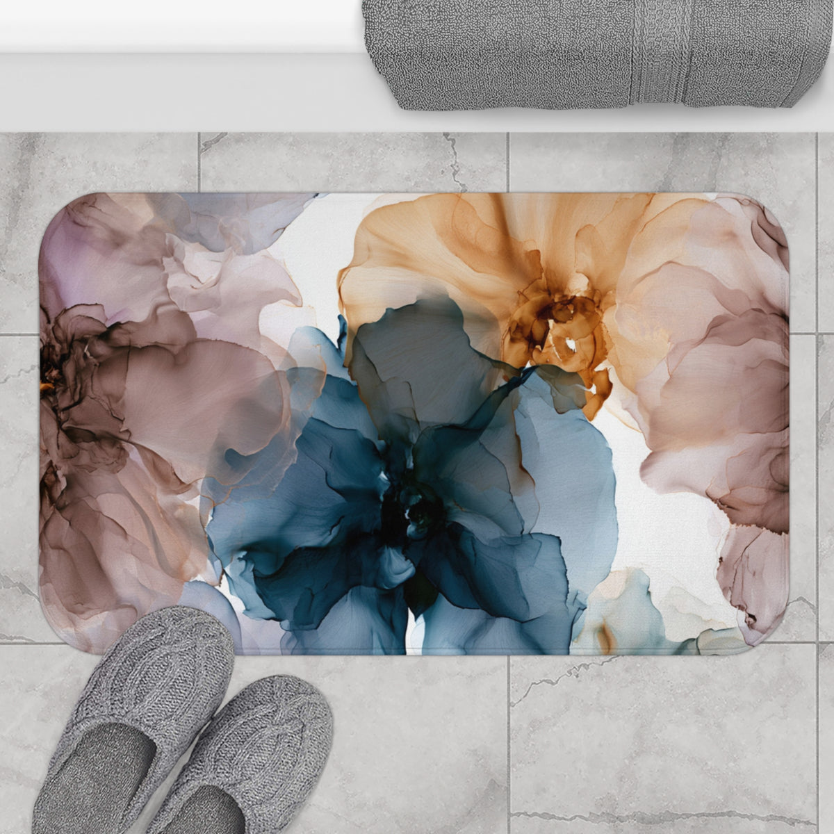a bathroom rug with a flower design on it