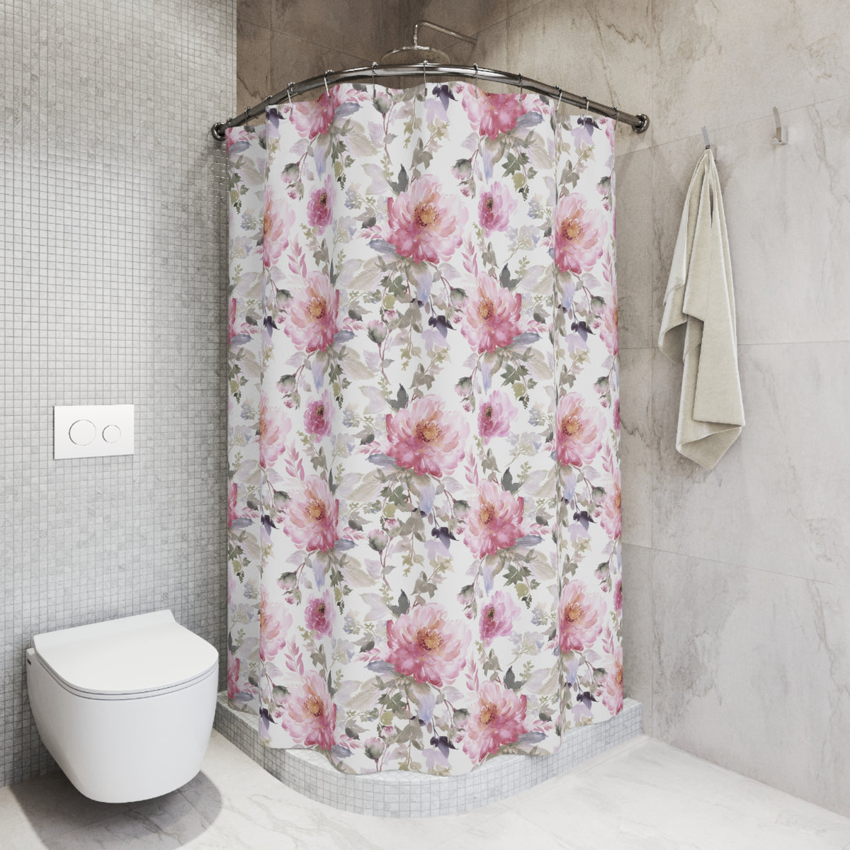 A bathroom with a shower curtain featuring a floral pattern in shades of pink and white. The shower curtain is hanging from a rod next to a towel. The bathroom has a white toilet and a tiled wall.