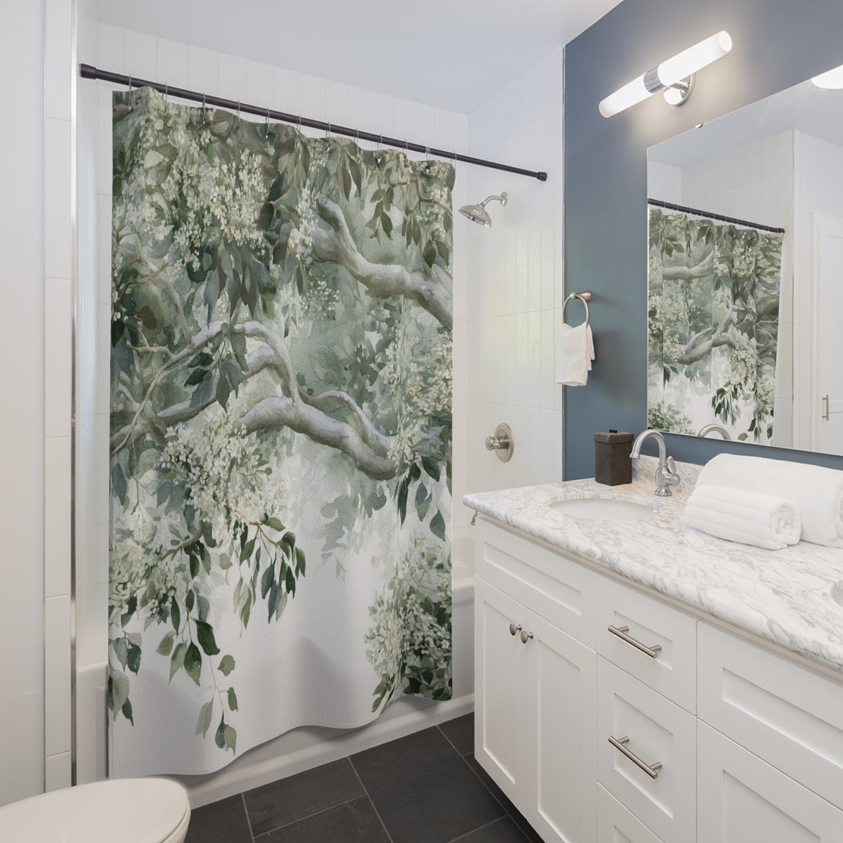 a modern bathroom with a white vanity, a large shower curtain with a green floral pattern, and a mirror above the vanity.