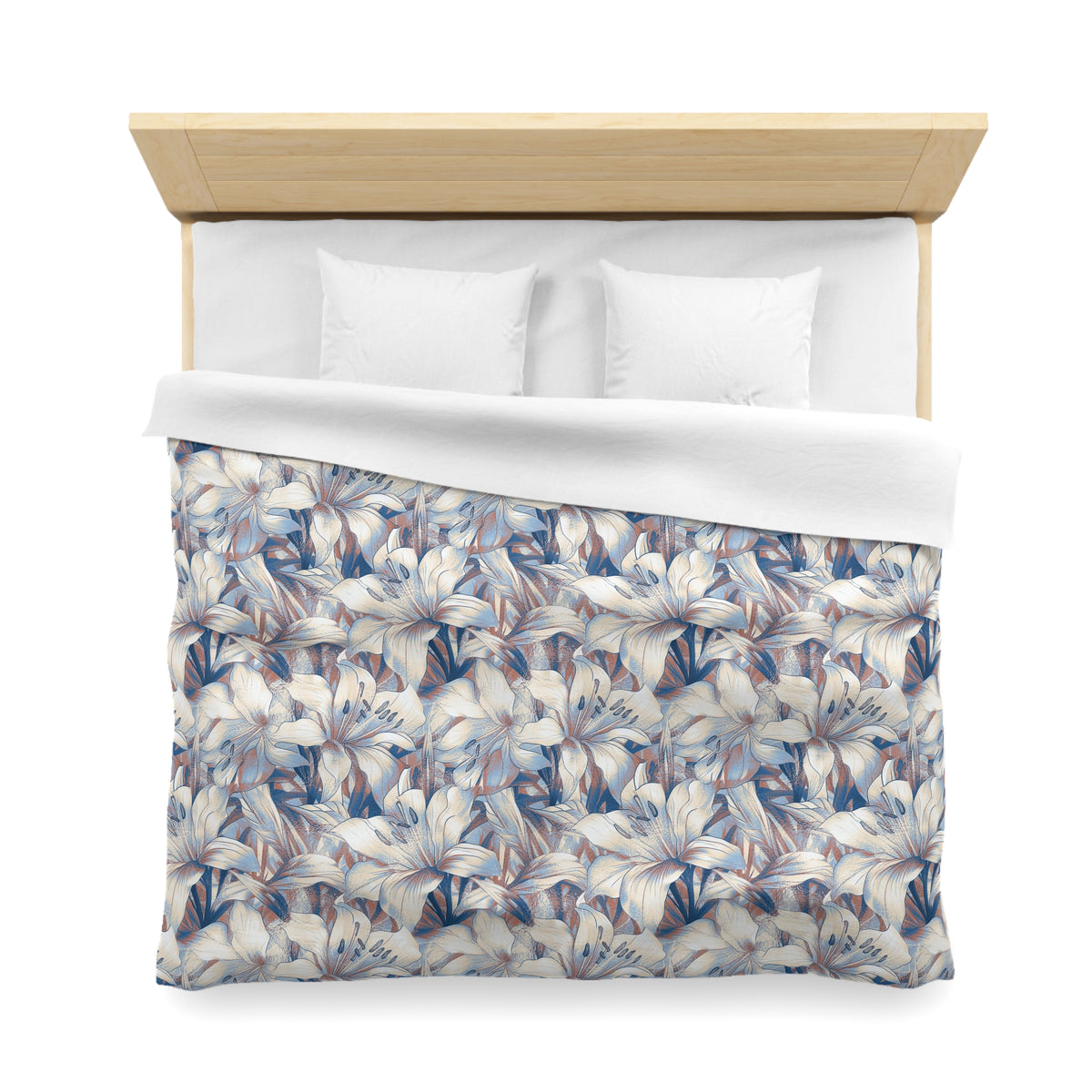 a neatly made bed with a floral patterned comforter and pillows.