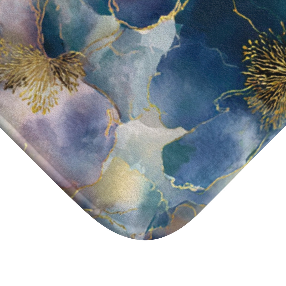 a close-up view of a marble-like pattern with blue, green, and gold colors. The pattern appears to be a decorative design, possibly used as a bath mat or rug.
