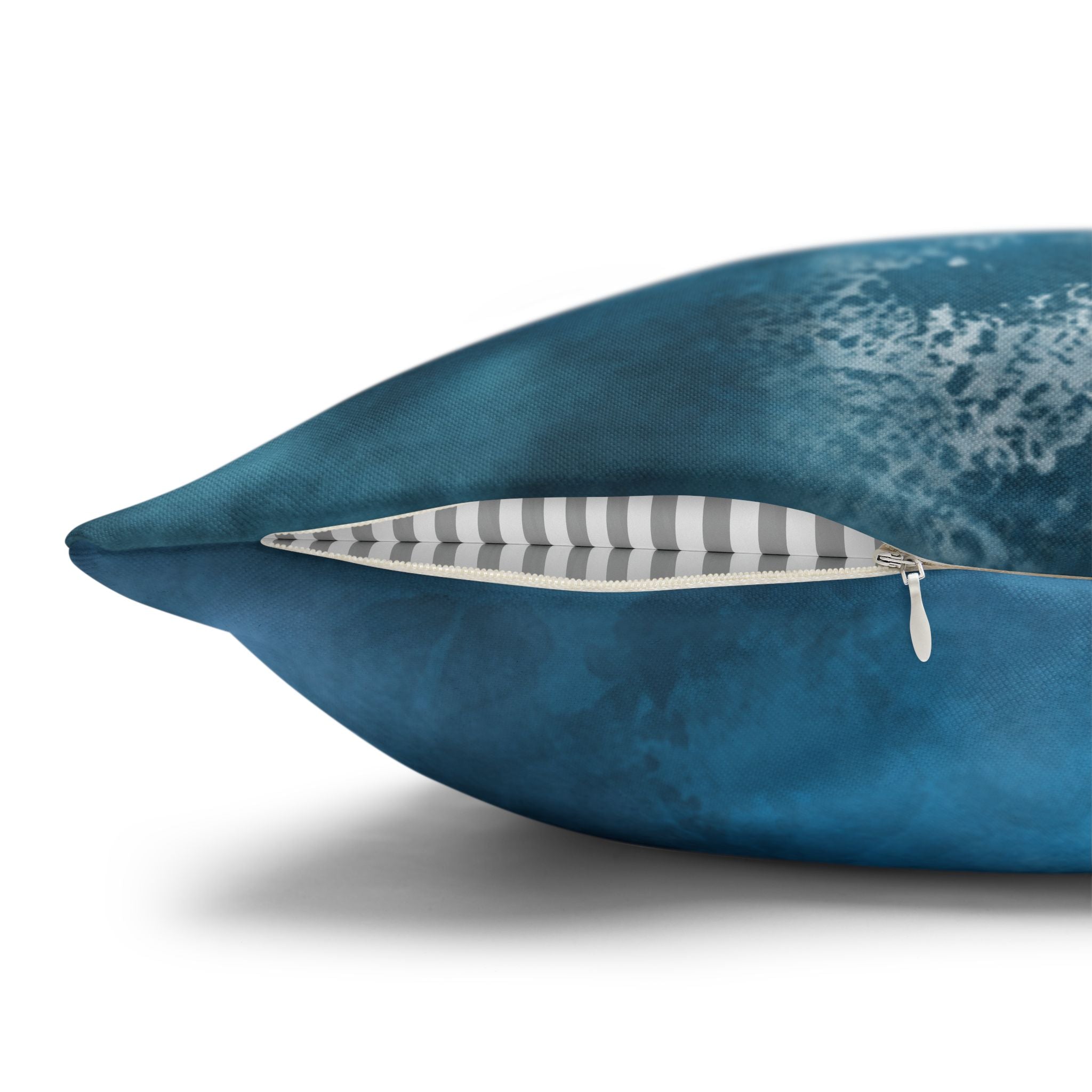 A close-up view of a blue pillow with a white and gray striped pattern inside the pillowcase.