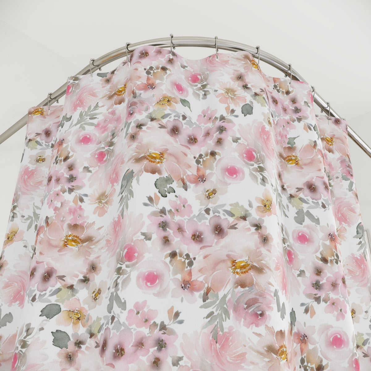 a shower curtain with a floral pattern in shades of pink and white.