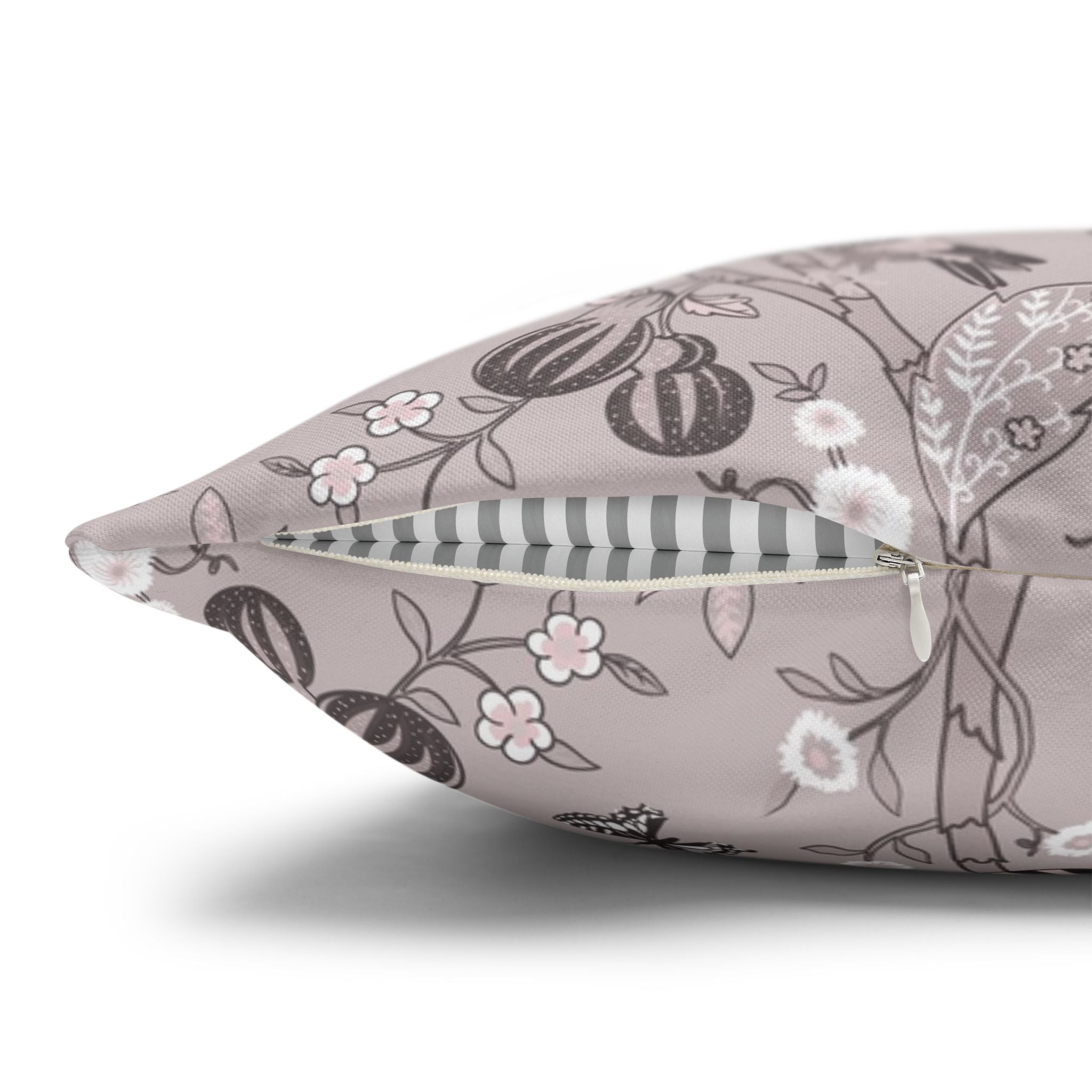 a close-up view of a decorative pillow with a floral pattern.