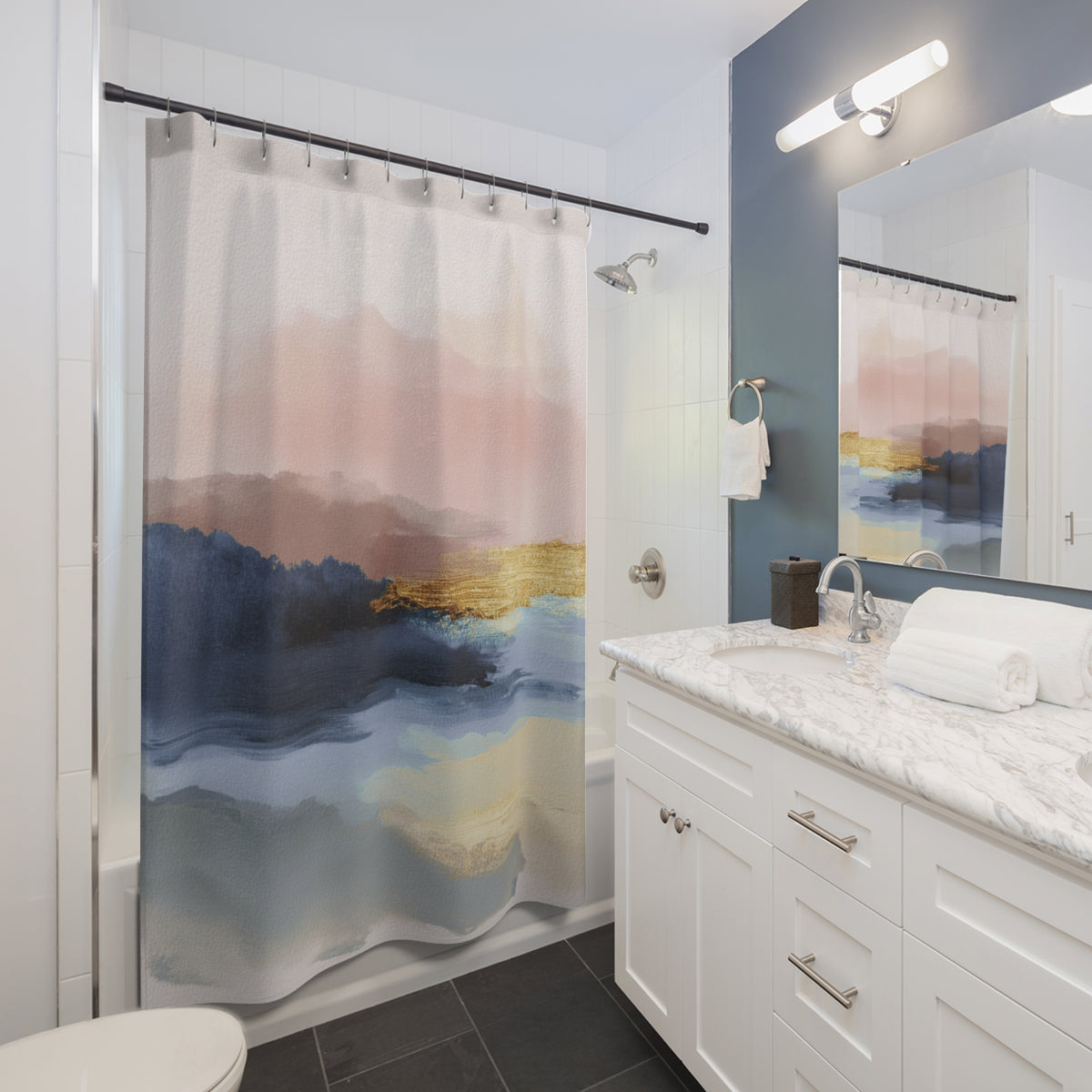 a modern bathroom with a white vanity, a shower curtain featuring a landscape design, and a mirror above the vanity.