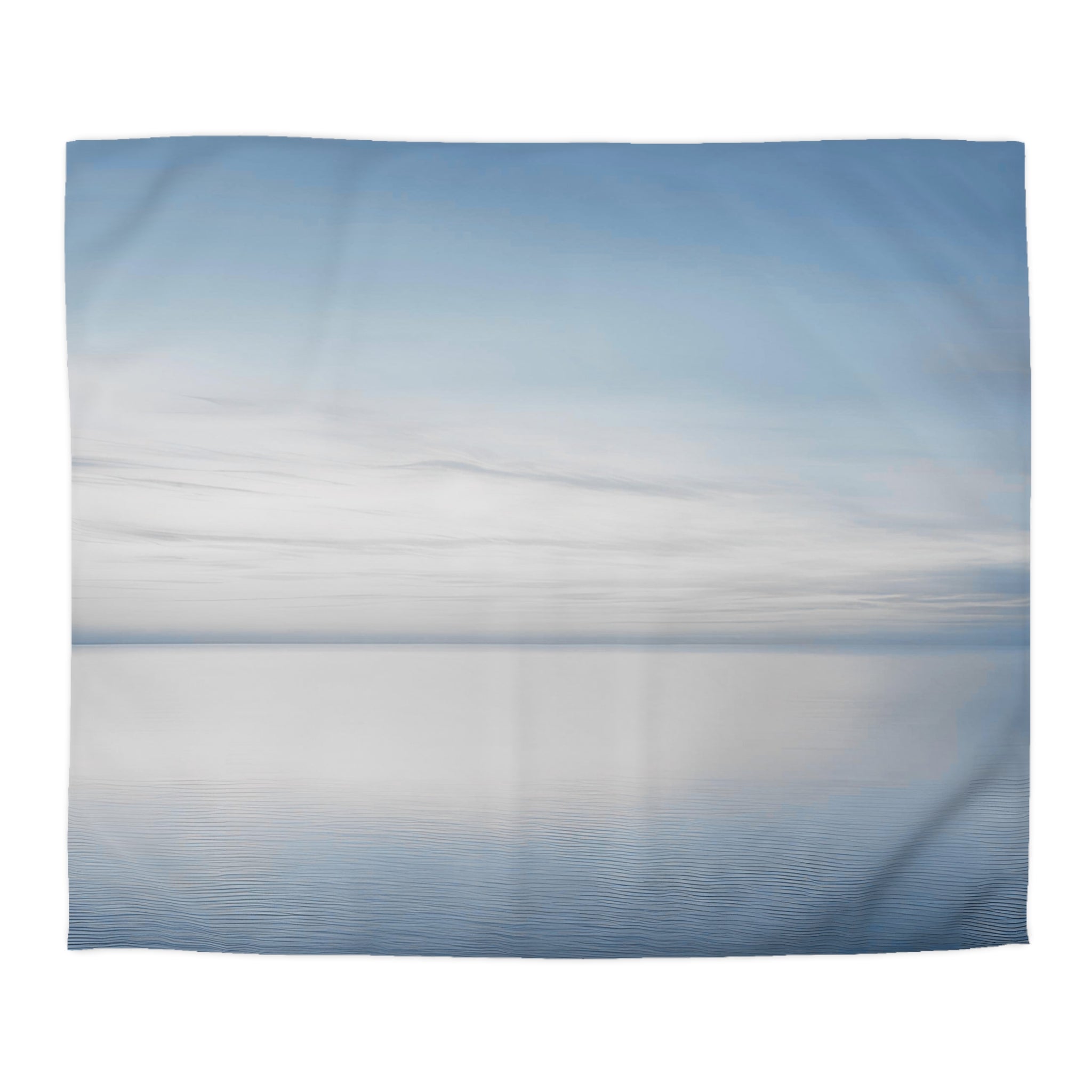 a serene scene of a calm body of water, possibly a lake or a sea, with a cloudy sky above.