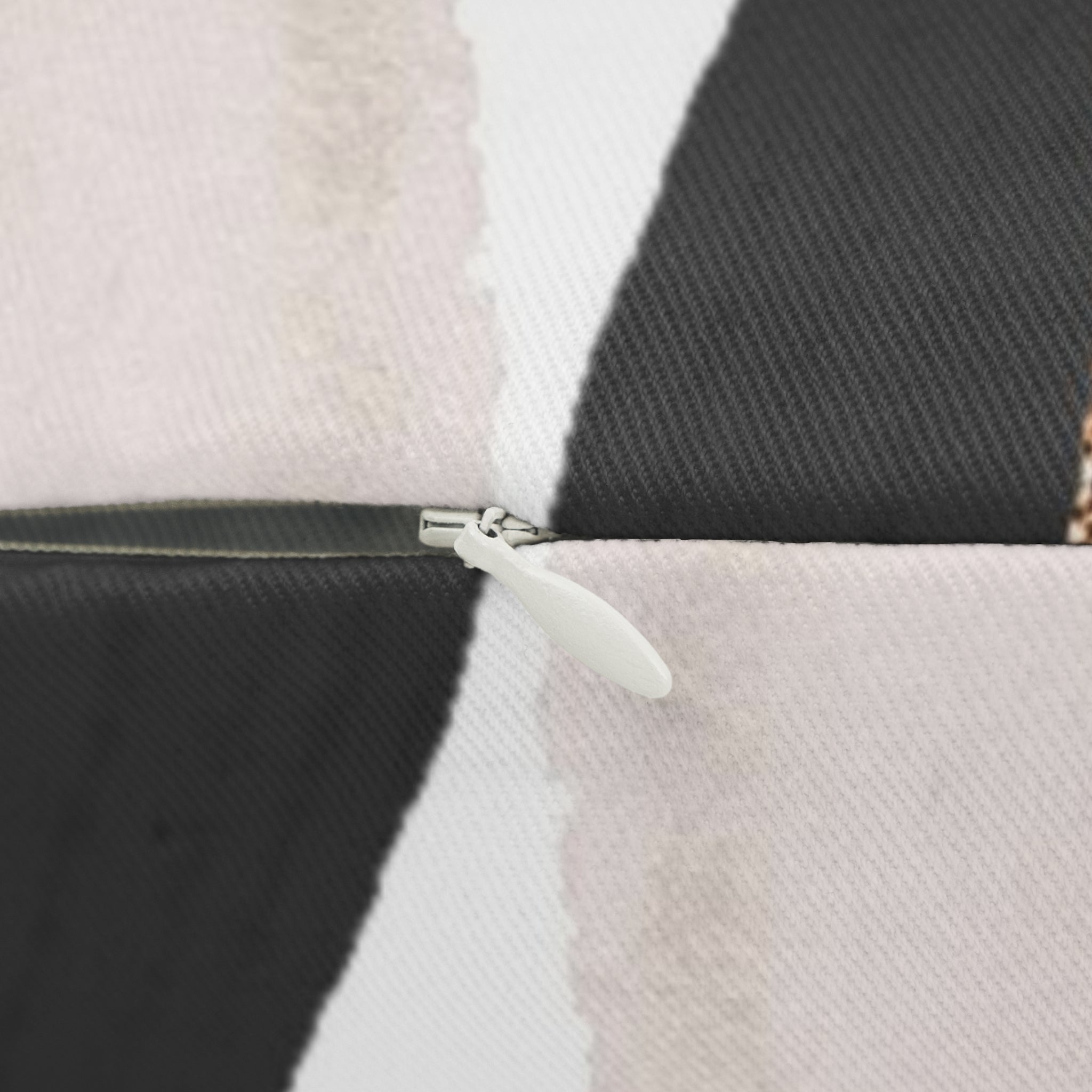 Black, ivory and white abstract lumbar pillow, close-up of the fabric detail