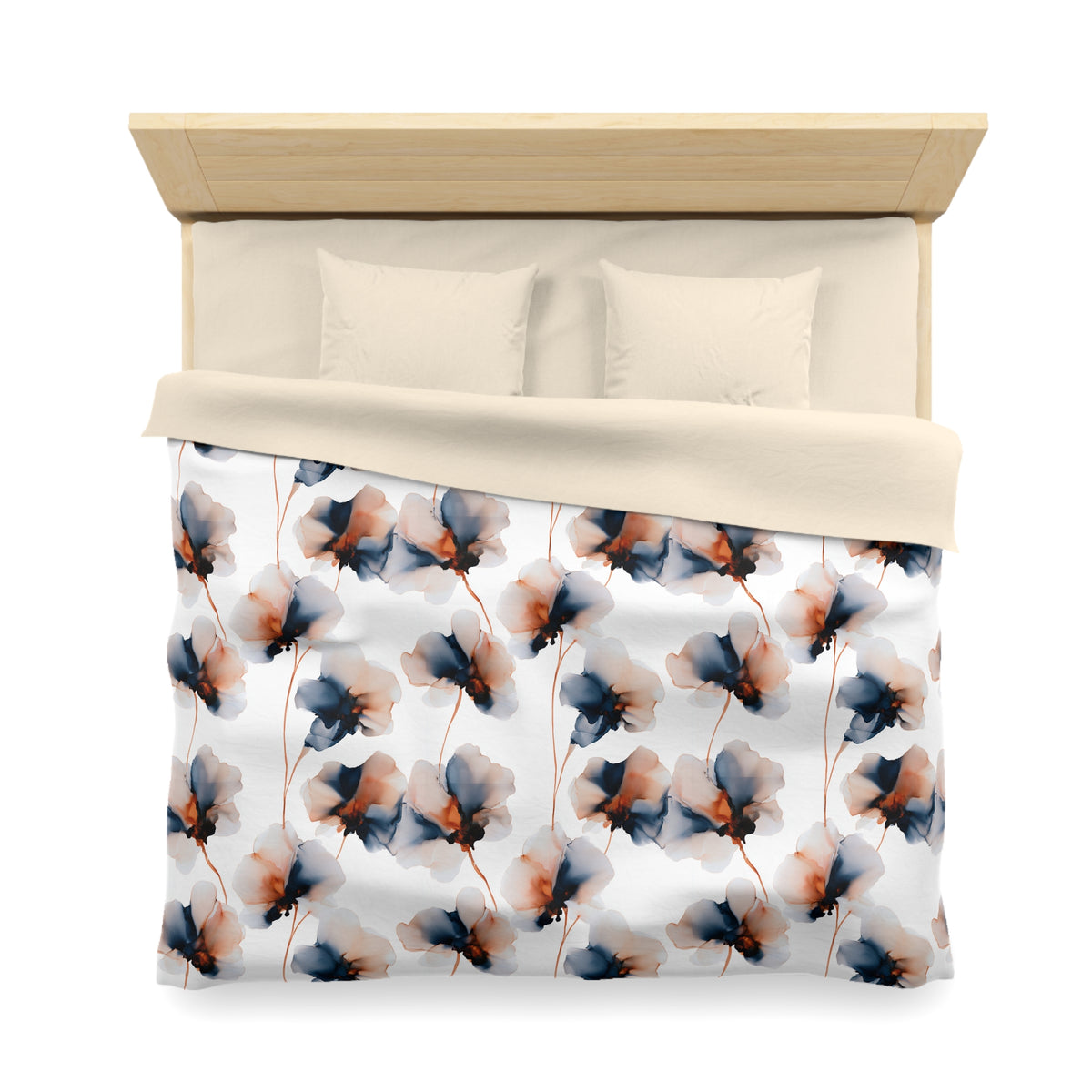 a bed with a floral patterned comforter and pillows.