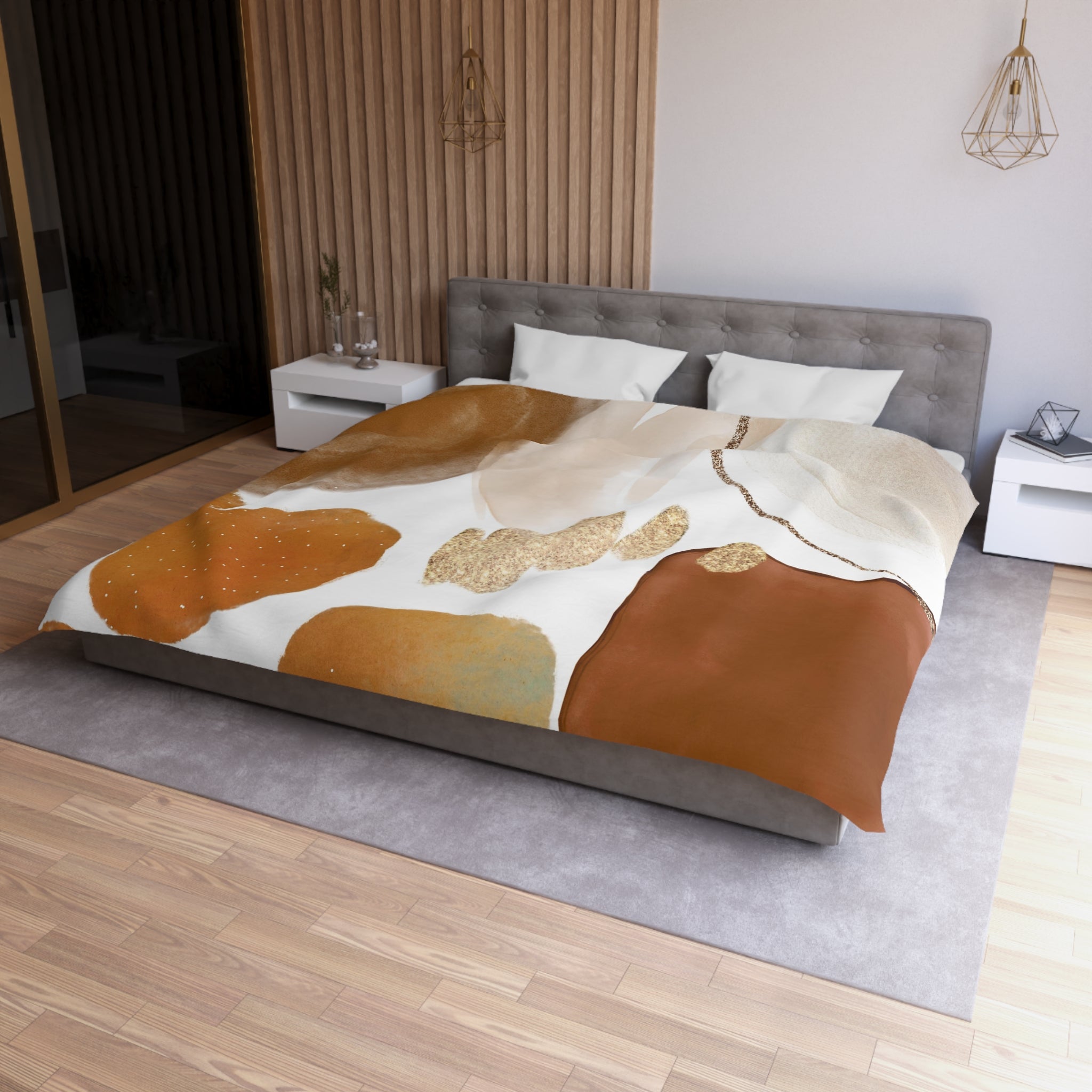 a modern bedroom with a large bed, a gray headboard, and a wooden floor. The bed is covered with a colorful, abstract-patterned comforter and pillows. There are two nightstands on either side of the bed, and a pendant light hangs above it. The room has a minimalist and stylish design, with a focus on natural materials and warm tones.