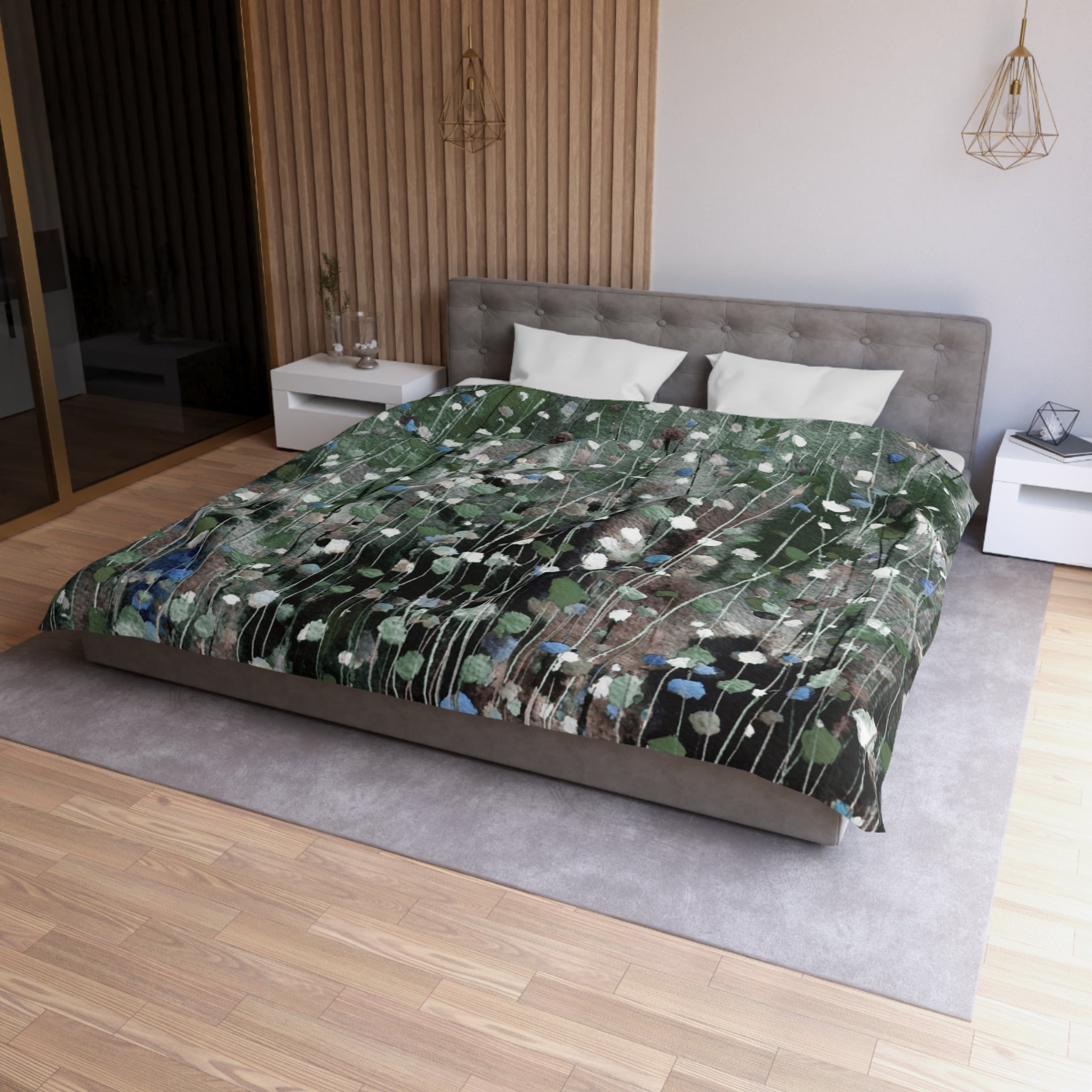 a modern bedroom with a large bed covered in a green and white floral patterned comforter. The bed is positioned against a wall with a wooden panel. The room also features a nightstand, a pendant light, and a rug on the floor.
