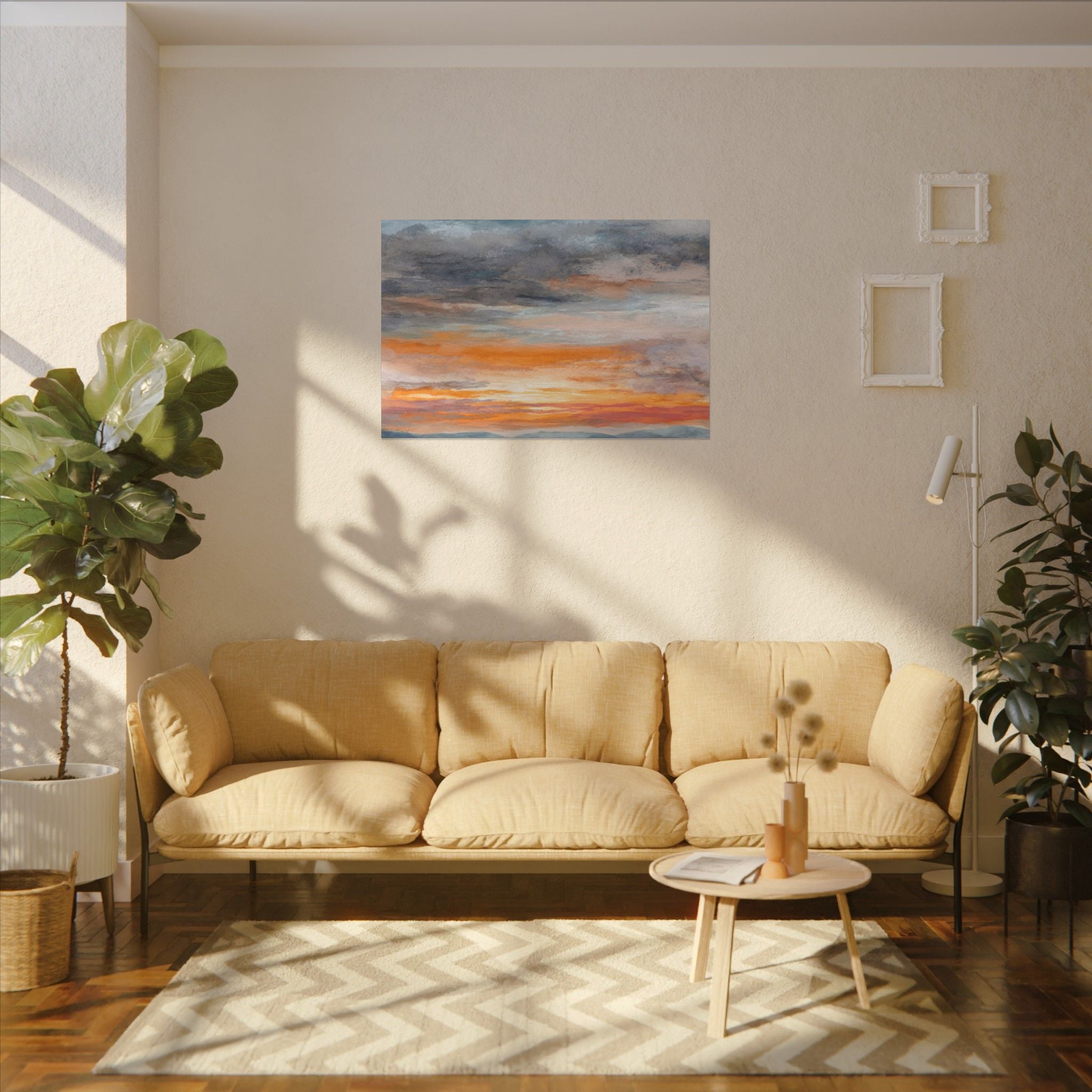 a cozy living room with a beige sofa, a coffee table, and a painting of a sunset on the wall.