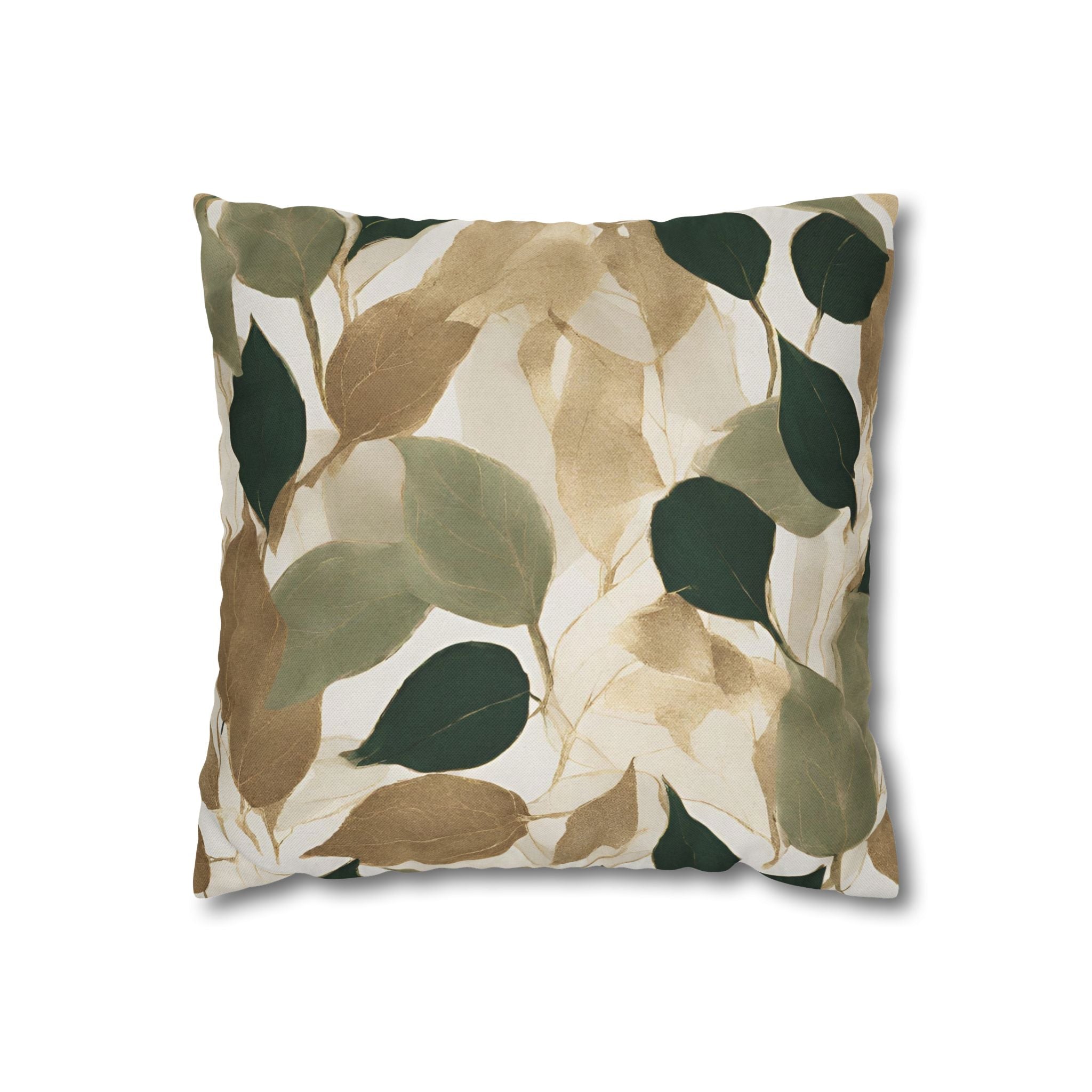 a square throw pillow with a leaf pattern in shades of green and brown.