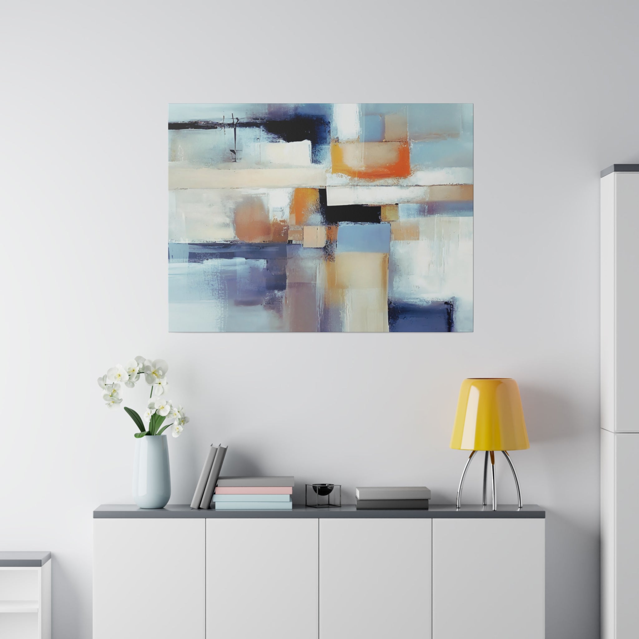 Blue and beige abstract canvas wall art hung above a sofa