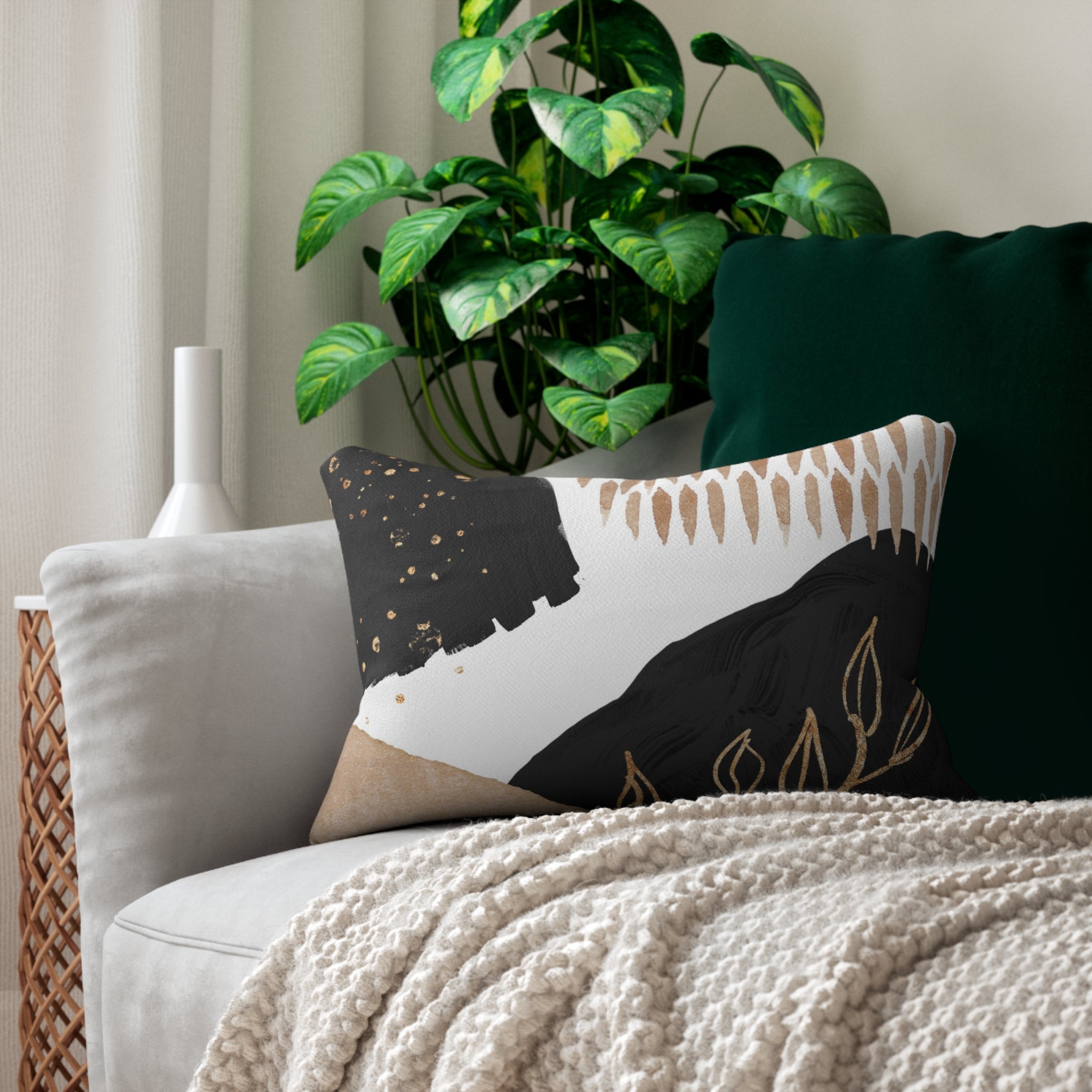 Black, white and beige abstract boho lumbar pillow in a modern living room