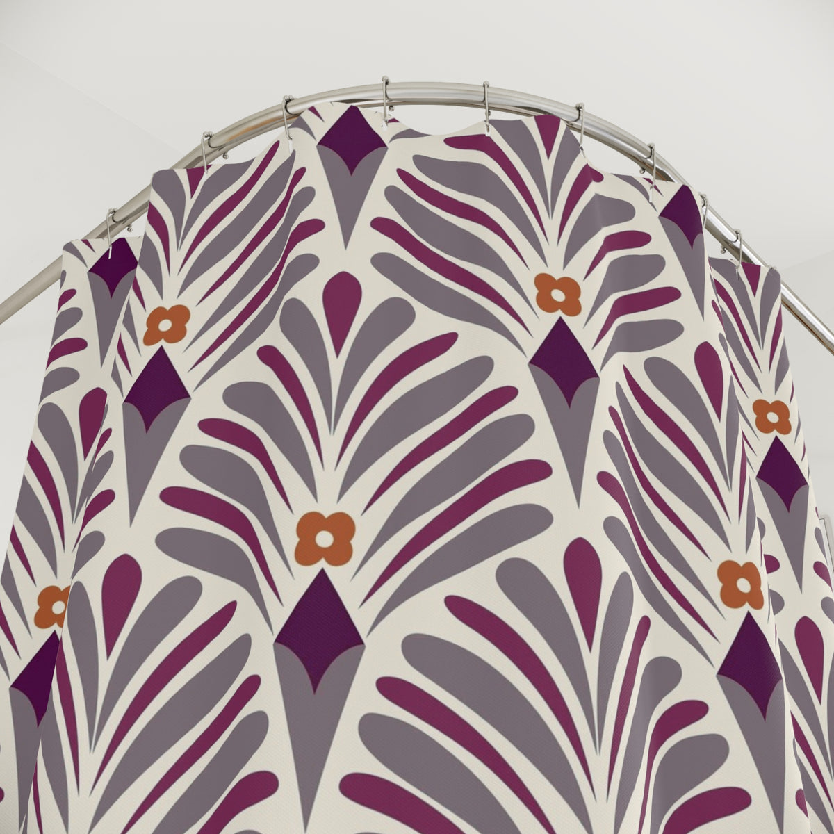 a shower curtain with a repeating pattern of purple and orange geometric shapes, including flowers.