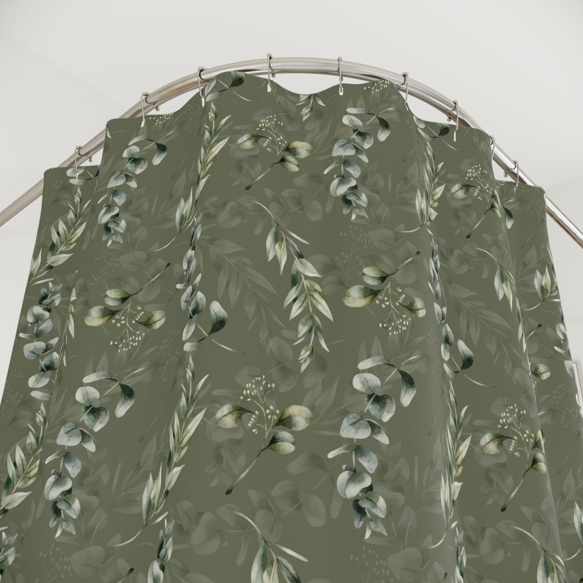 a shower curtain with a repeating pattern of green leaves and flowers, creating a natural and organic design.