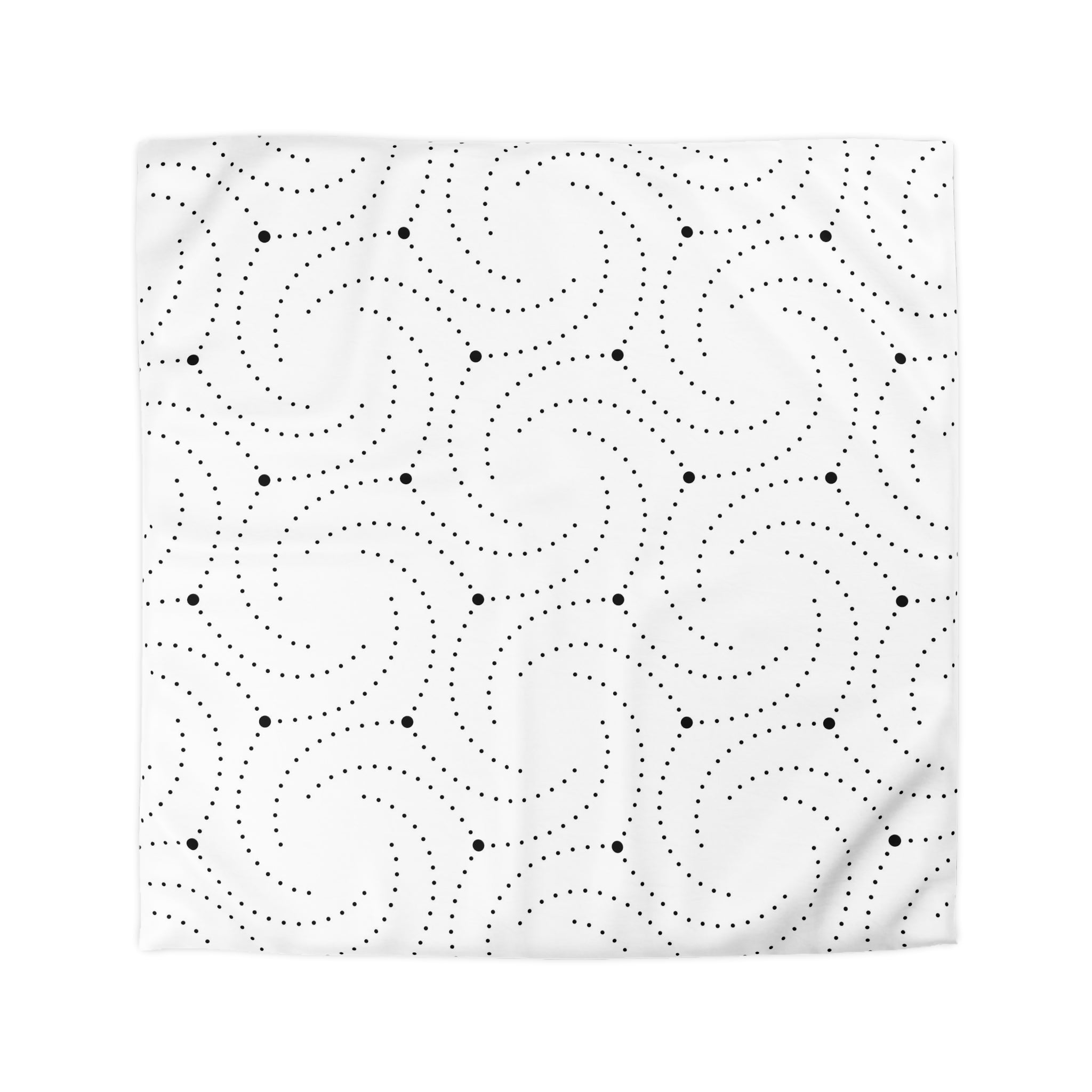 a repeating pattern of black dots and swirls on a white background.