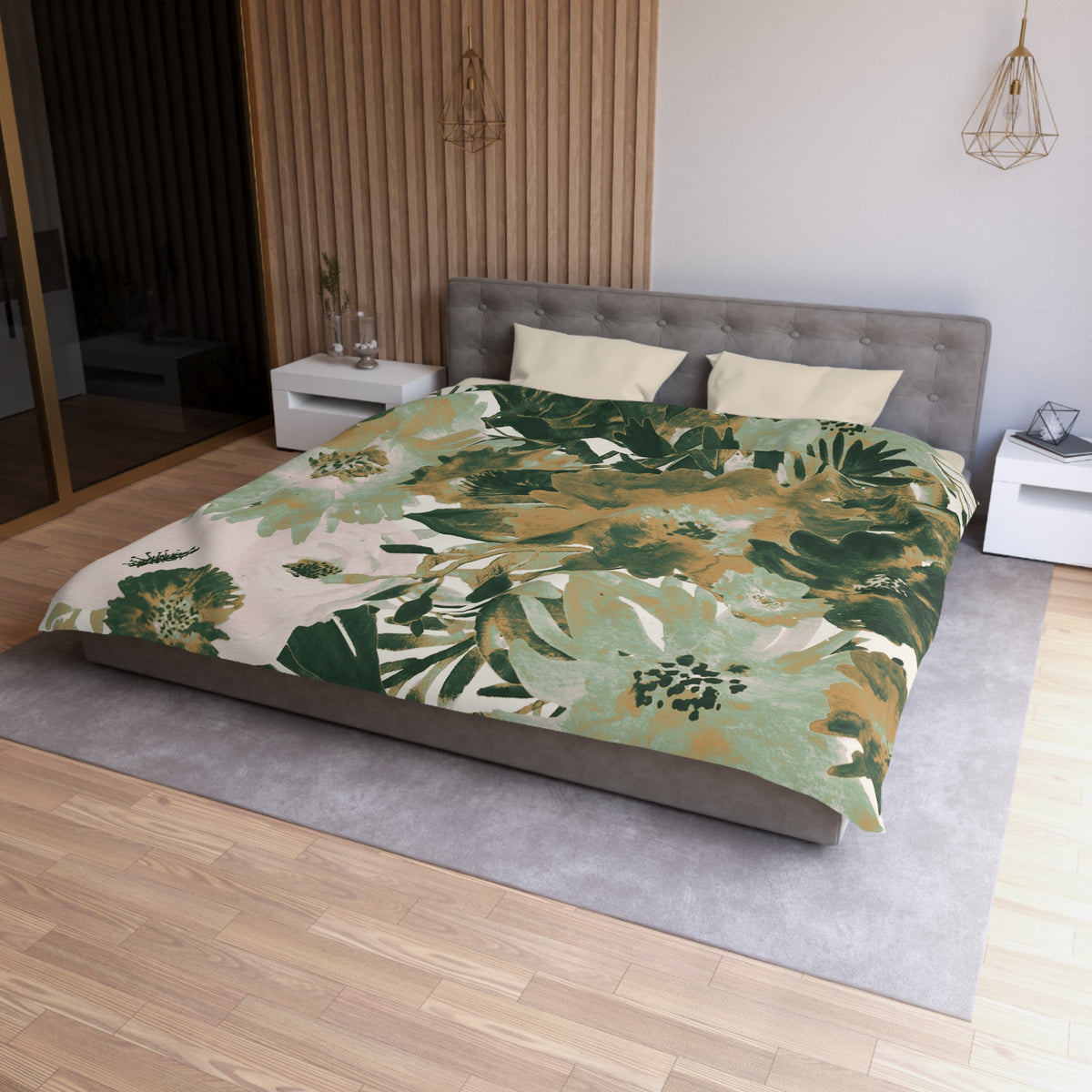 a modern bedroom with a large bed covered in a green and white floral comforter. The bed is positioned against a wall with a wooden panel. The room also features a nightstand, a pendant light, and a vase on a surface.