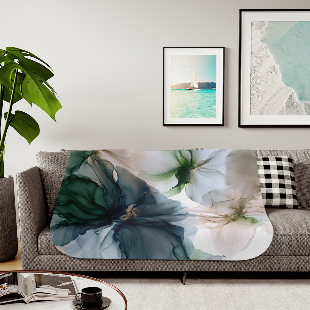 a living room with a couch, coffee table and pictures on the wall