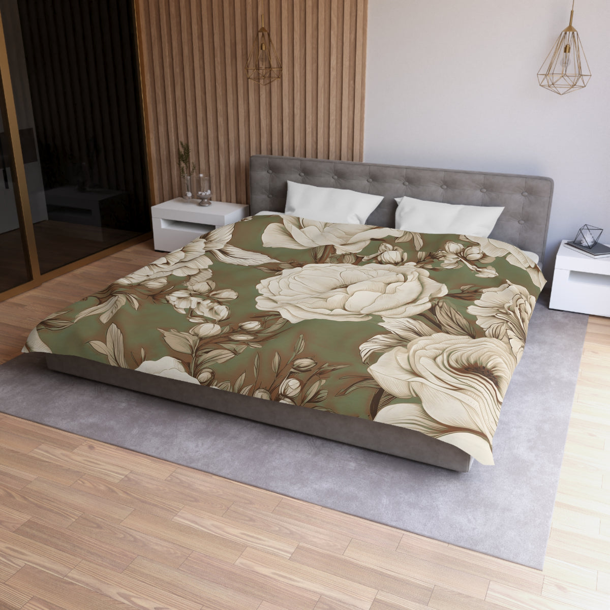 a modern bedroom with a large bed covered in a floral print comforter. The bed is positioned against a wall with a wooden panel. The room has a minimalist design, with white walls and a gray carpet. There are two nightstands on either side of the bed, and a pendant light hangs above the bed.