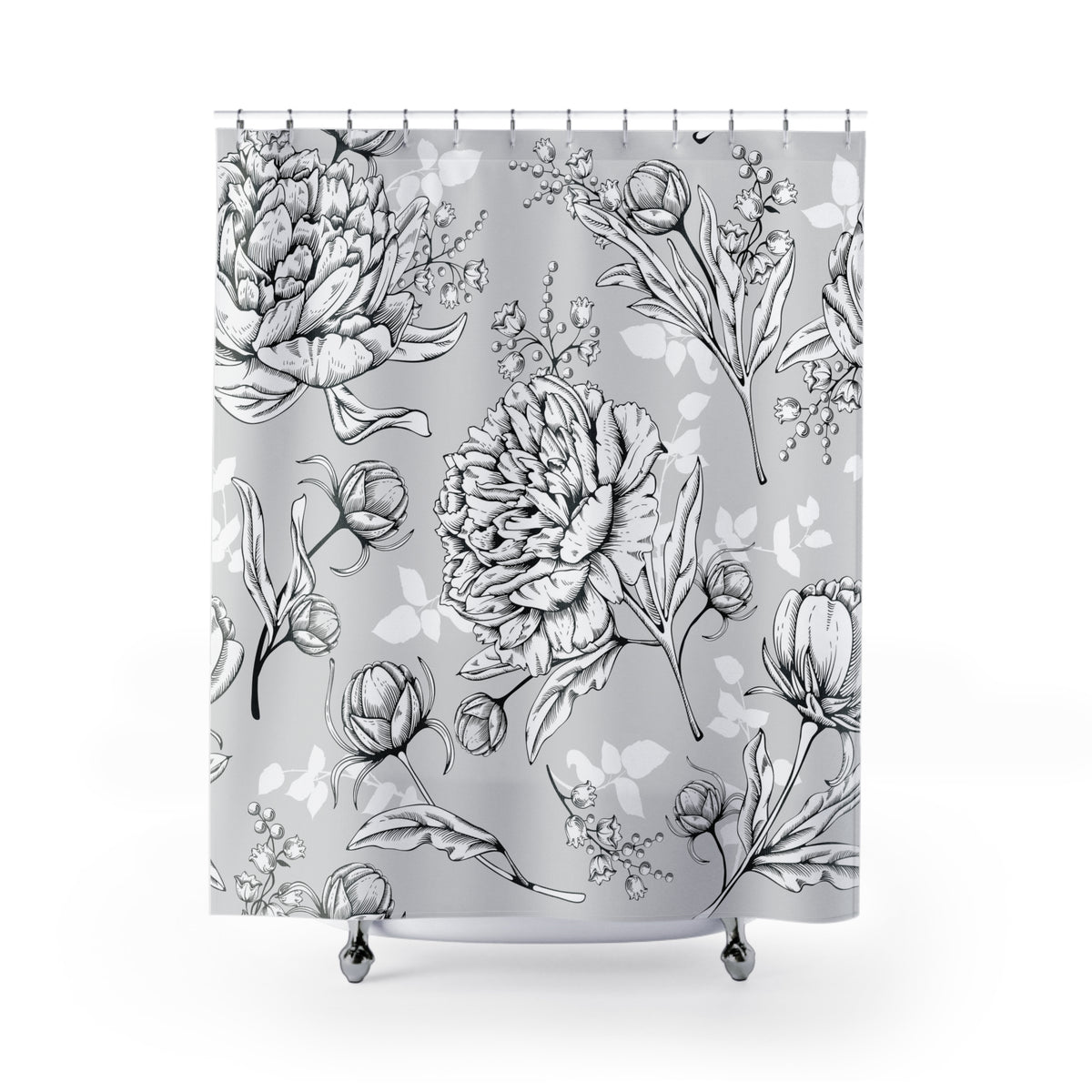a shower curtain with a repeating pattern of black and white flowers and leaves.