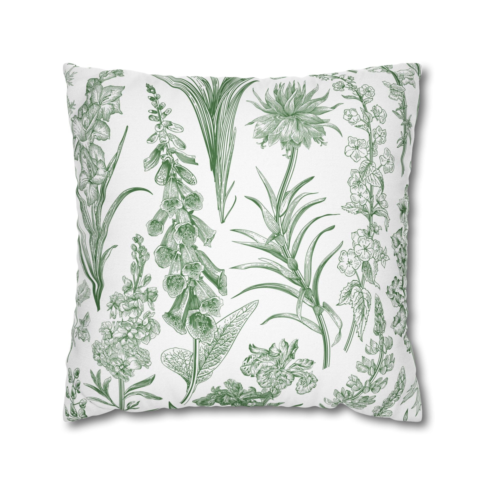 a square pillow with a repeating pattern of green floral and leaf illustrations.