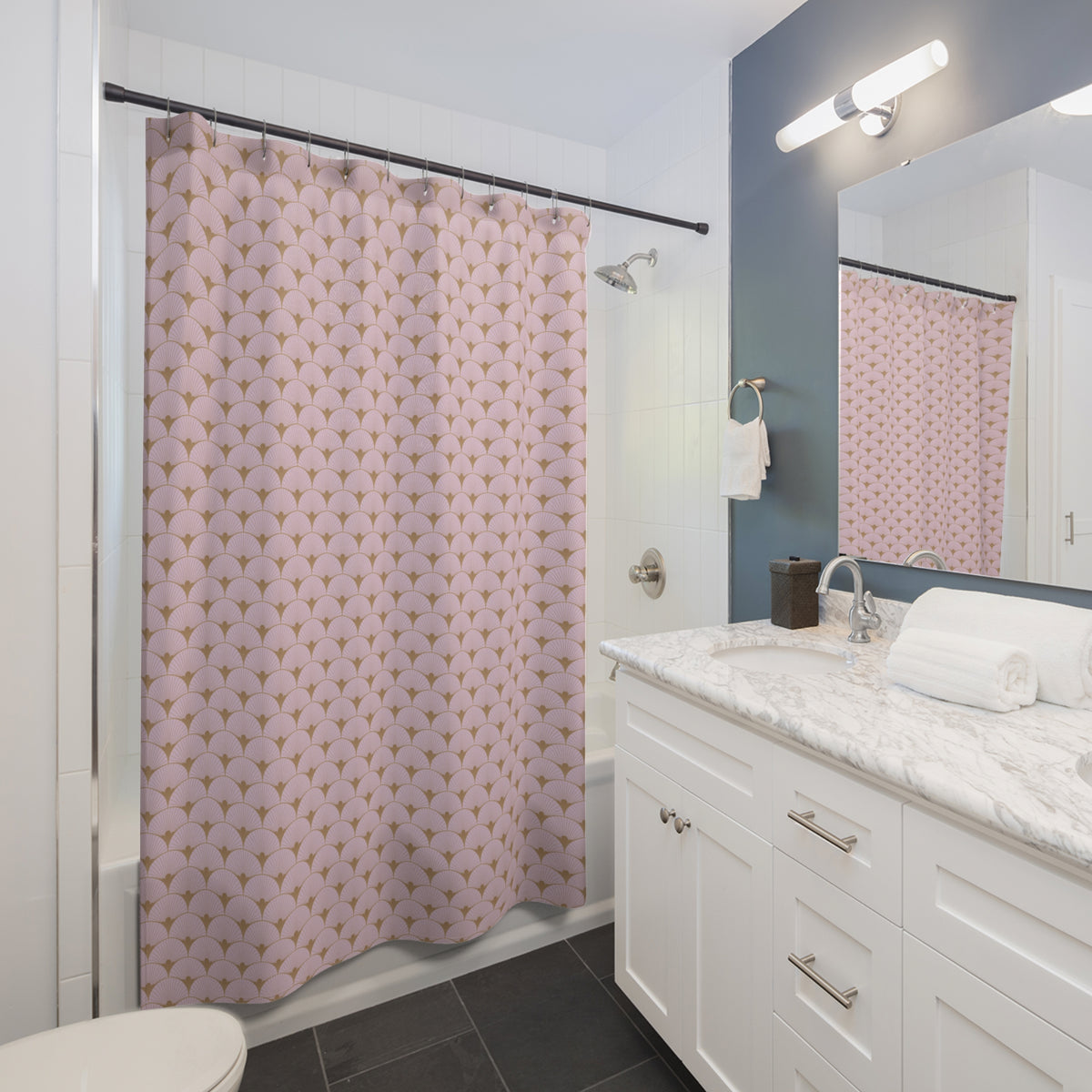 a modern bathroom with a white vanity, a shower curtain with a pink and gold pattern, and a mirror above the sink.