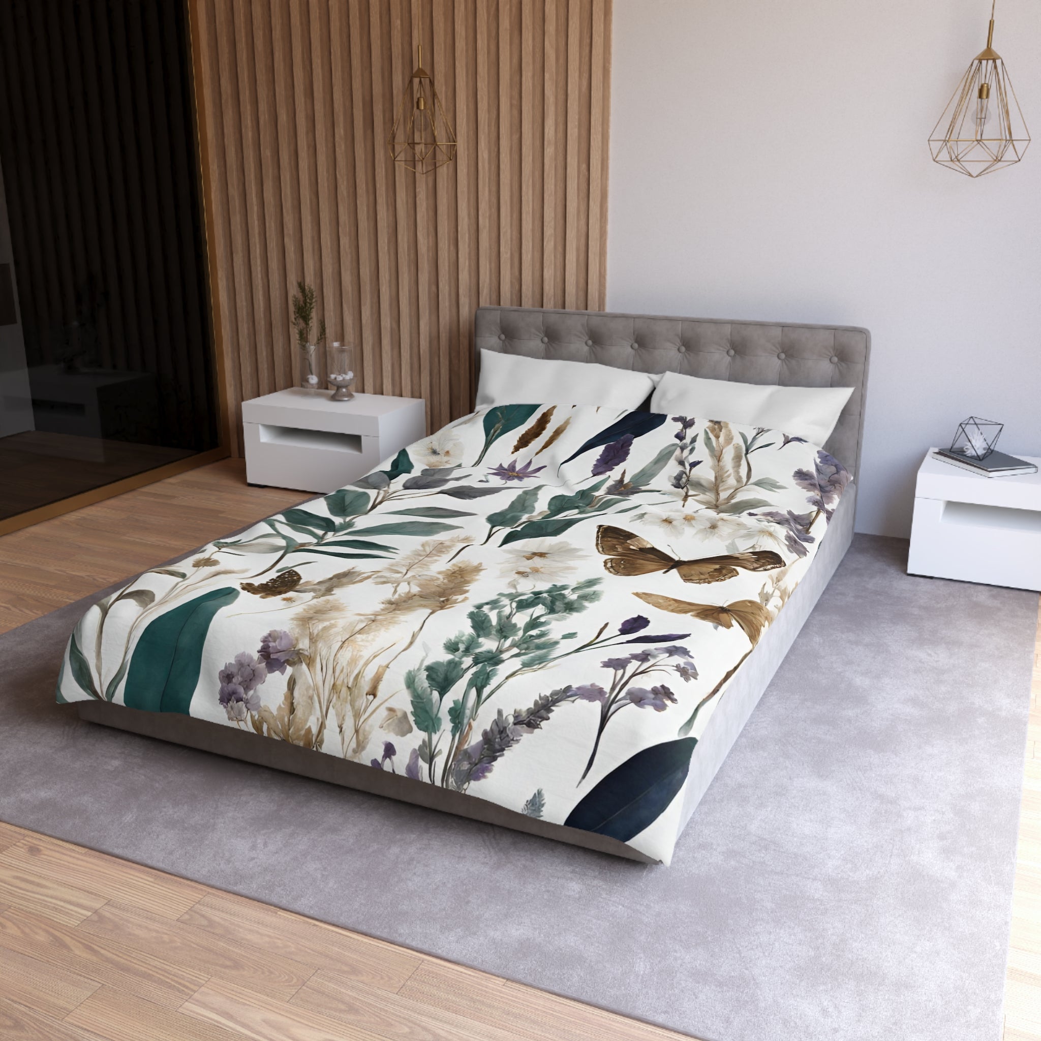 a modern bedroom with a large bed covered in a floral print comforter. The bed is positioned against a wall with a wooden panel design. The room has a minimalist and clean aesthetic, with white furniture and a gray carpet.