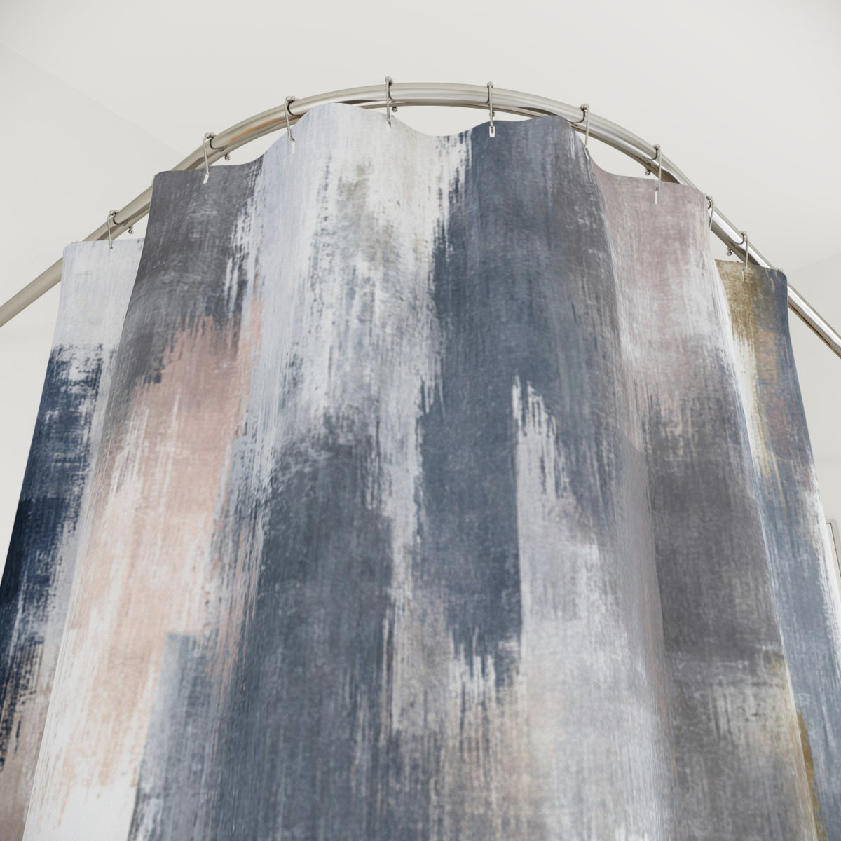 a shower curtain with a unique abstract pattern in shades of gray, blue, and white. The curtain is hanging from a curved rod, creating an interesting visual effect.