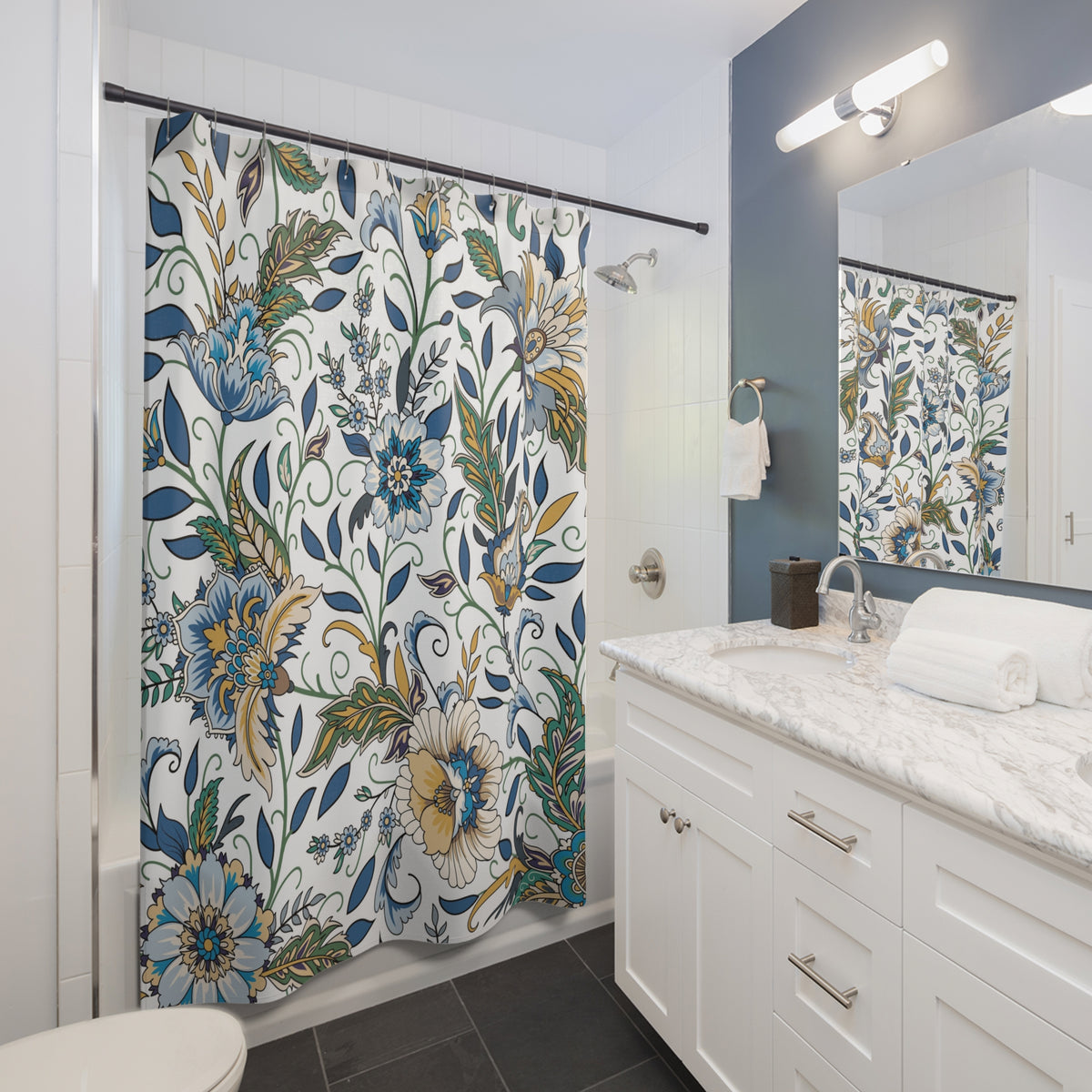 a modern bathroom with a white vanity, a floral shower curtain, and a mirror above the vanity.