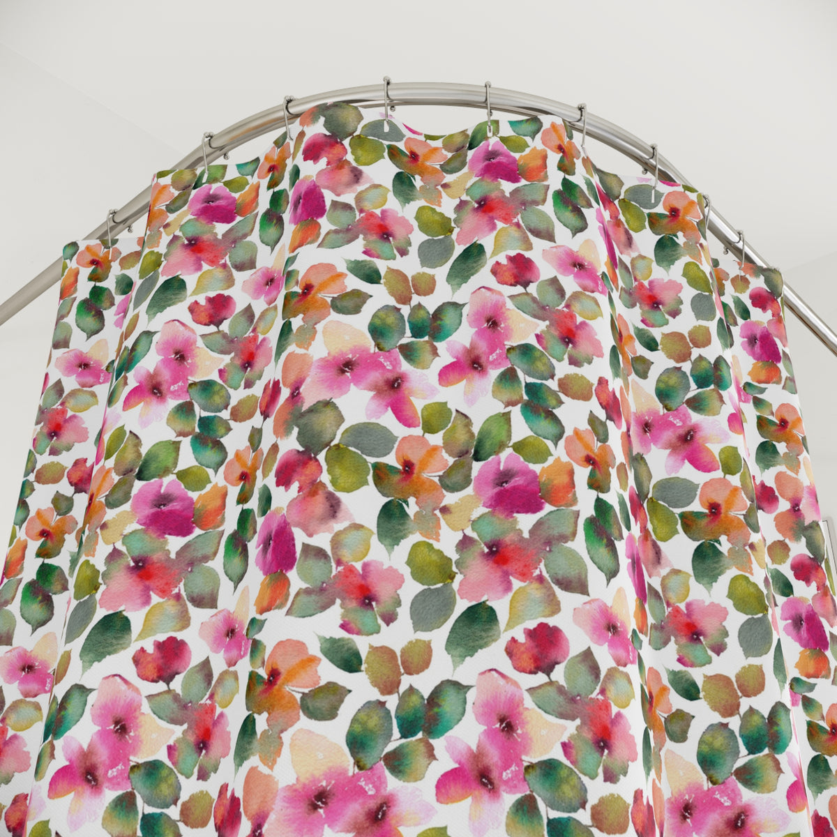 a shower curtain with a vibrant floral pattern in shades of pink, green, and orange.