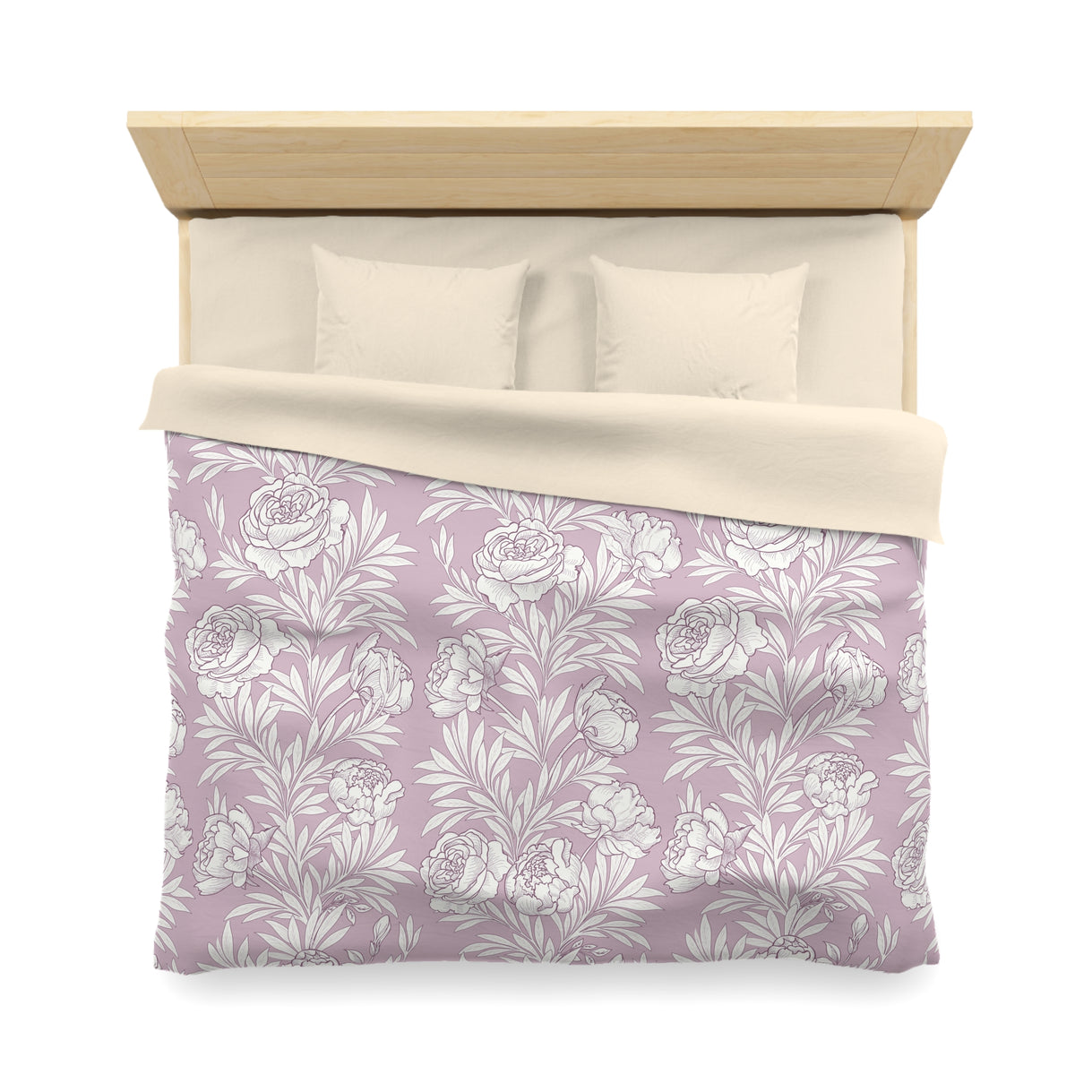 a neatly made bed with a floral patterned comforter and pillows.