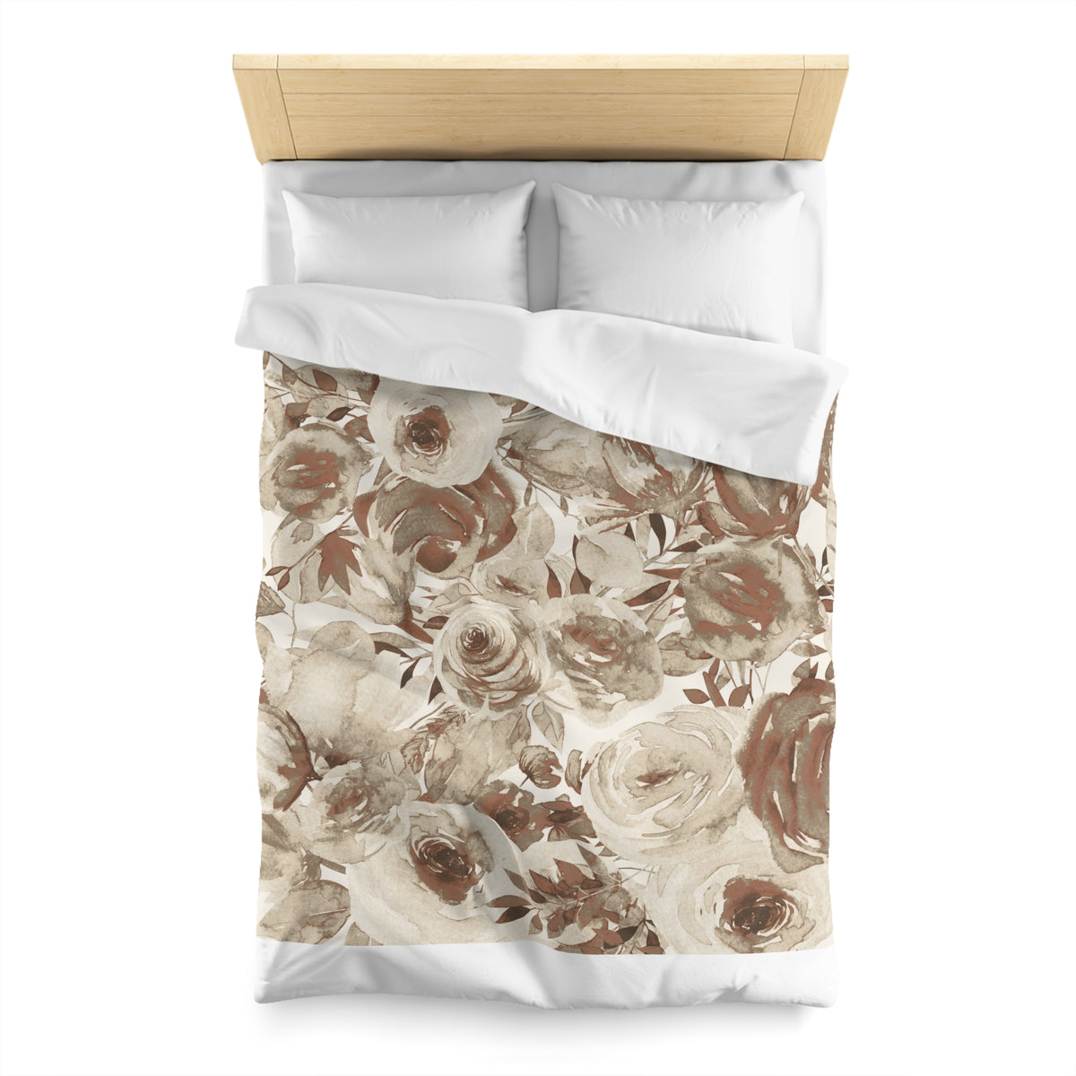 a bed with a floral print duvet cover and pillows.