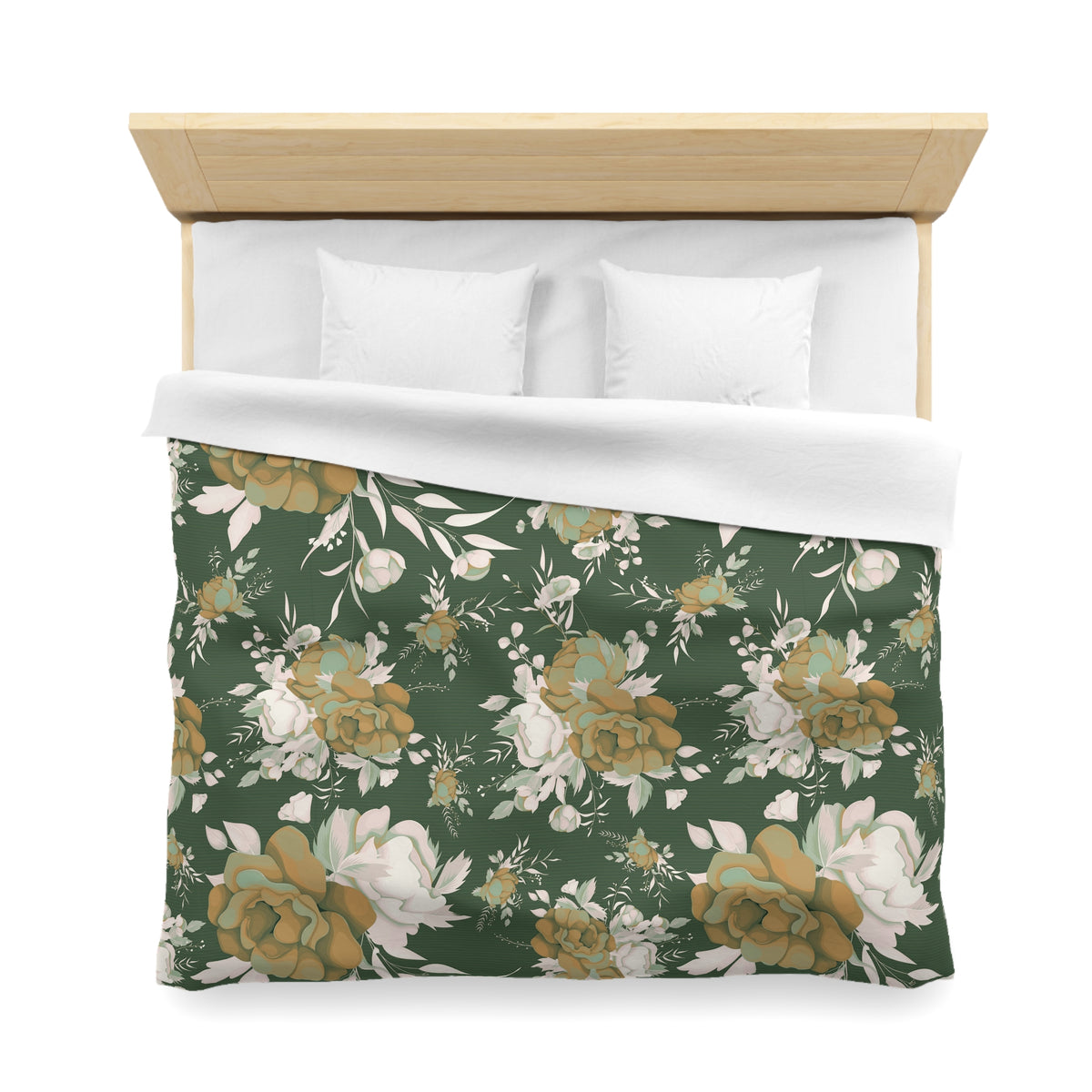 a bed with a floral print duvet cover and white pillows.