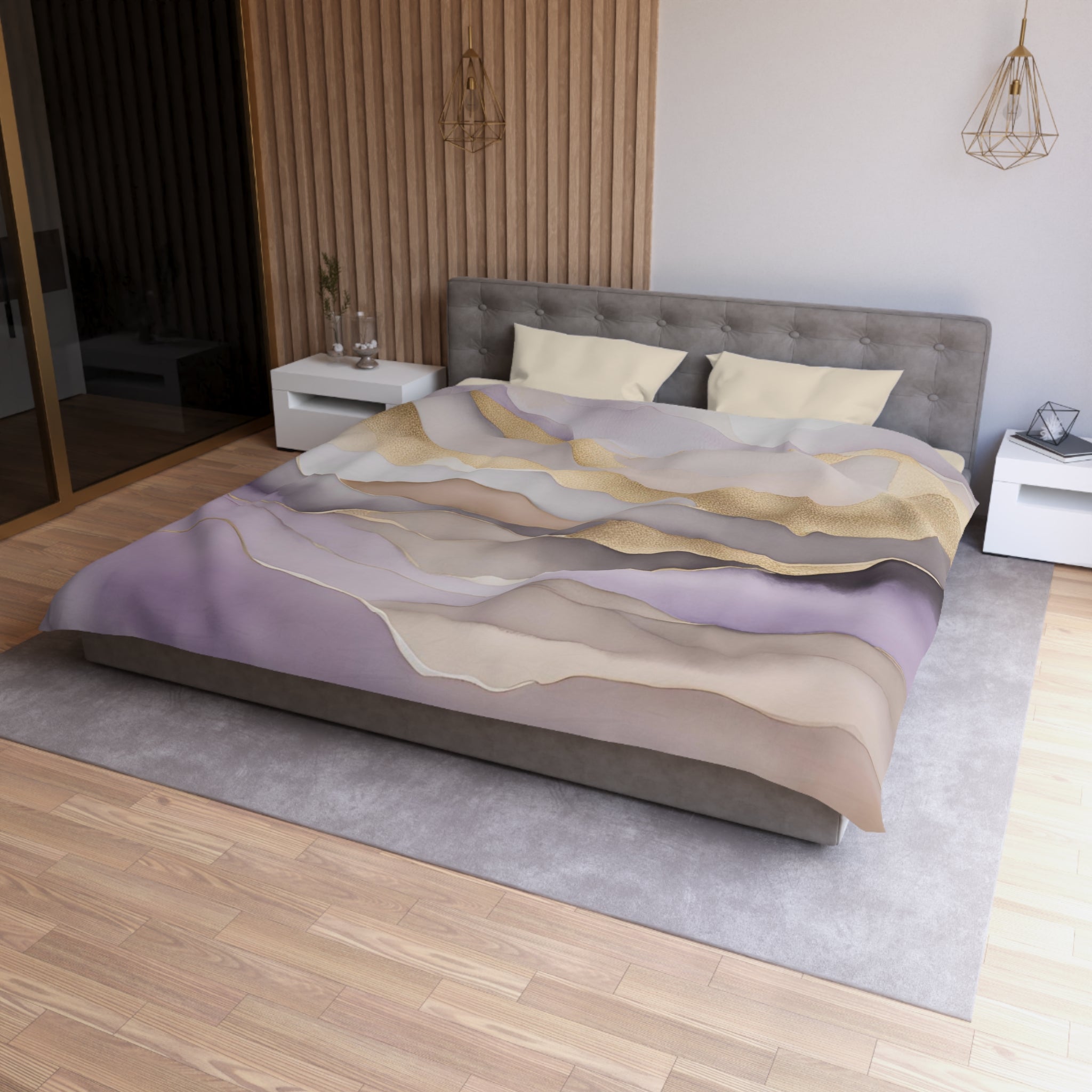a modern bedroom with a large bed, a gray headboard, and a colorful patterned comforter. The room has a wooden floor and white walls, creating a clean and minimalist aesthetic.