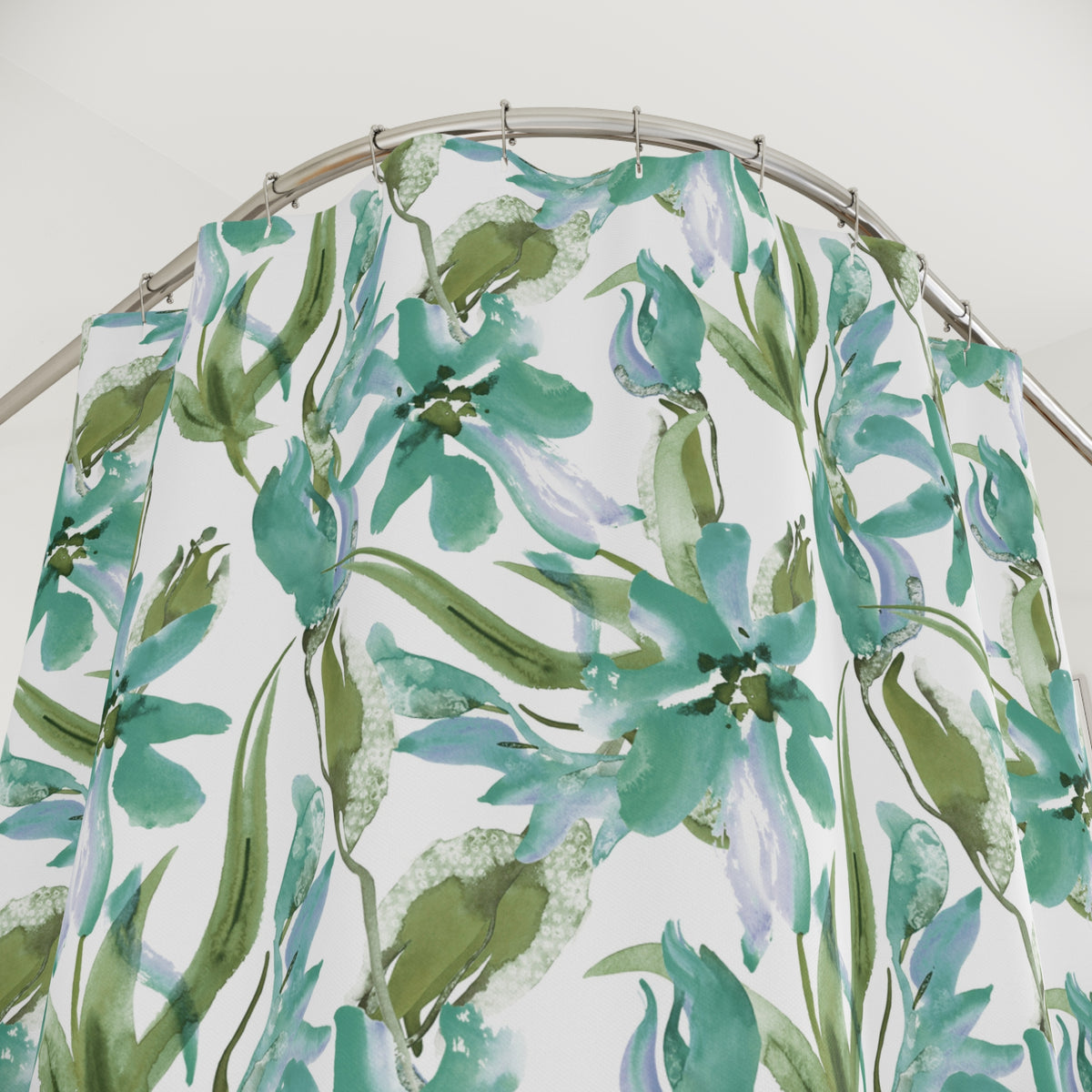 a shower curtain with a floral pattern in shades of green and white.
