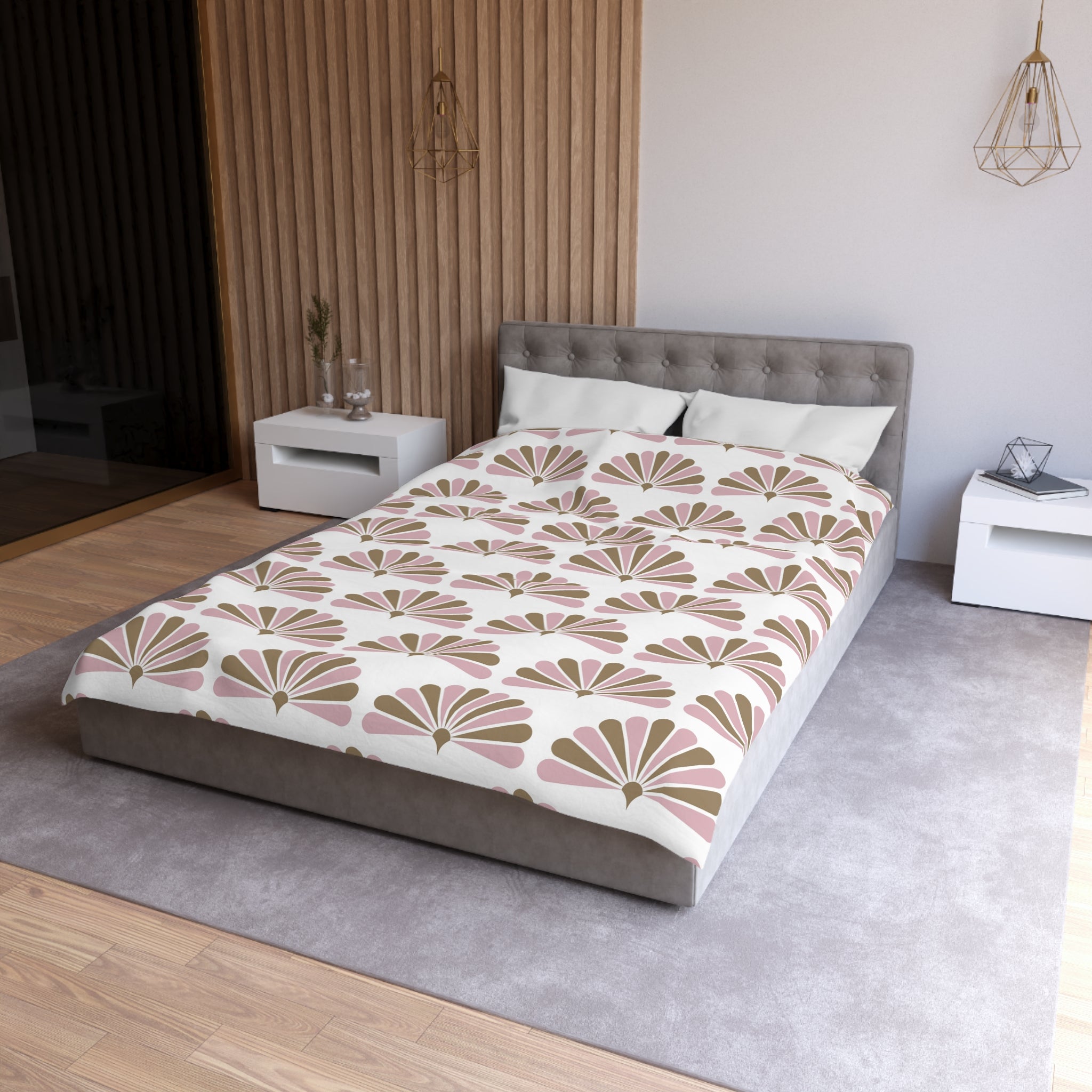 a modern bedroom with a gray tufted headboard, a white bedspread with a floral pattern, and a gray nightstand on the right side of the bed.