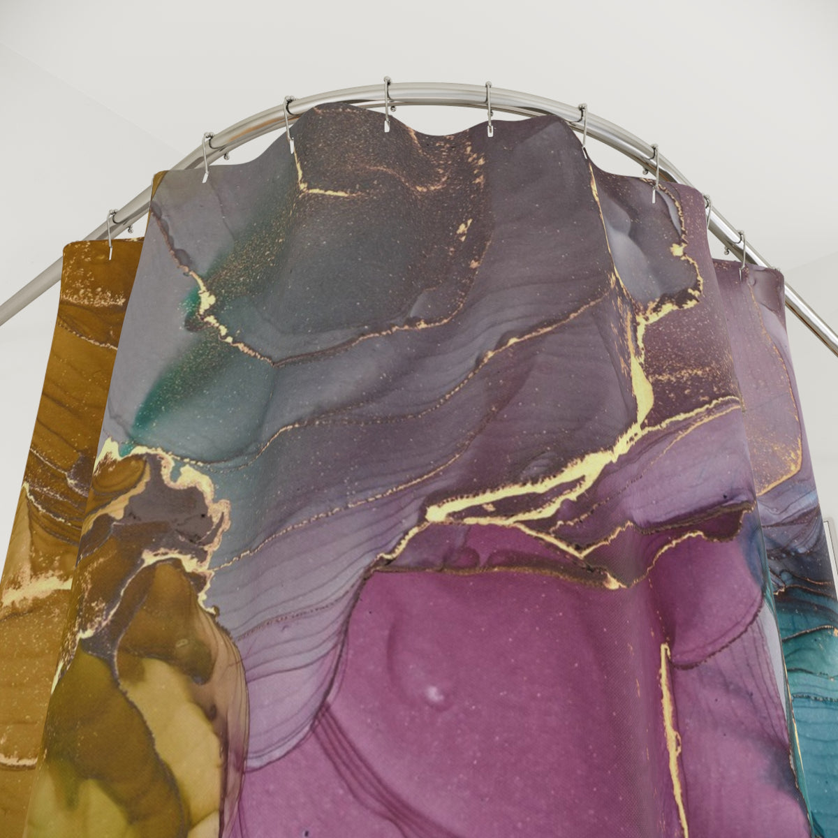 a shower curtain with a colorful abstract pattern, including shades of purple, green, and gold.