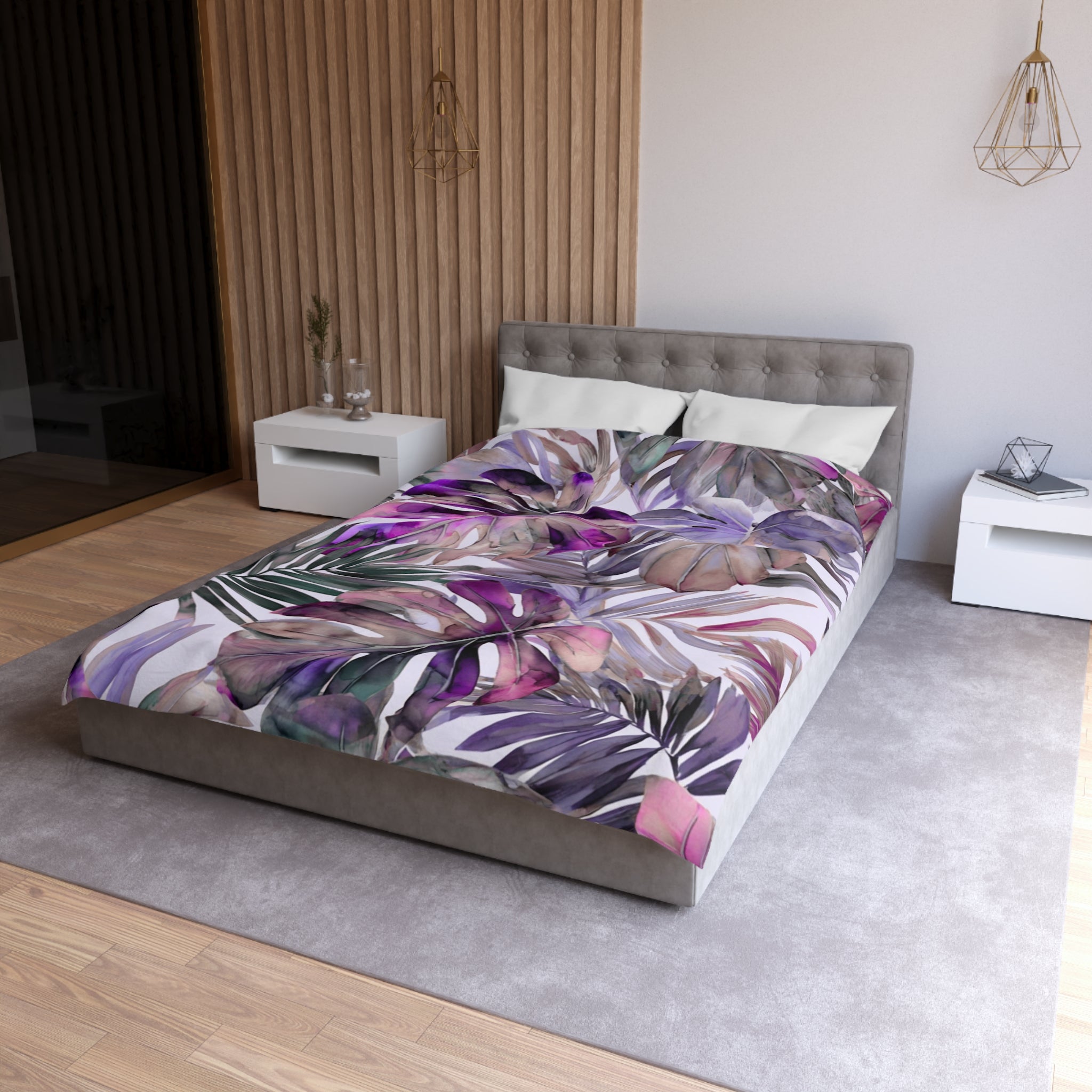 a modern bedroom with a large bed covered in a colorful, tropical-themed bedspread. The bed is positioned against a wall with a wooden panel design. The room also includes a nightstand and a pendant light fixture, creating a cozy and stylish atmosphere.