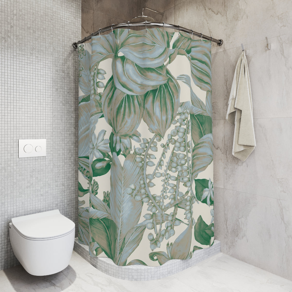 a bathroom with a shower curtain adorned with a tropical plant print in shades of green and white. The shower curtain is hanging on a rod next to a towel rack. The bathroom has a white toilet and a tiled wall, creating a clean and modern aesthetic.